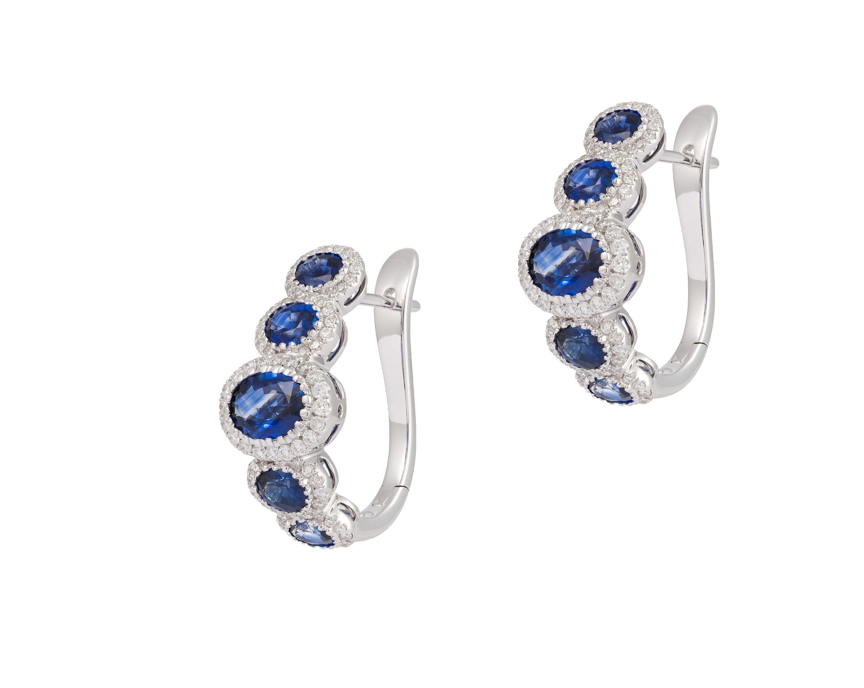 The Following Item we are offering is this Rare Important Radiant 18KT Gold Gorgeous Glittering and Sparkling Magnificent Fancy Sapphire Diamond Semi Hoop Earrings. Earrings contain almost 4.50CTS of Beautiful Fancy Shimmering Blue Sapphires and