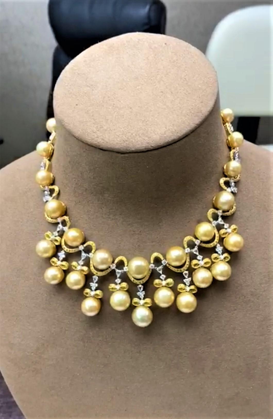 The Following Item we are offering is this Beautiful Important 18KT Gold Magnificent Rare Fancy Yellow Diamond Golden South Sea Pearl Necklace. Necklace is comprised of 30 Beautiful Magnificent High Luster Large South Sea Golden Pearls that gives