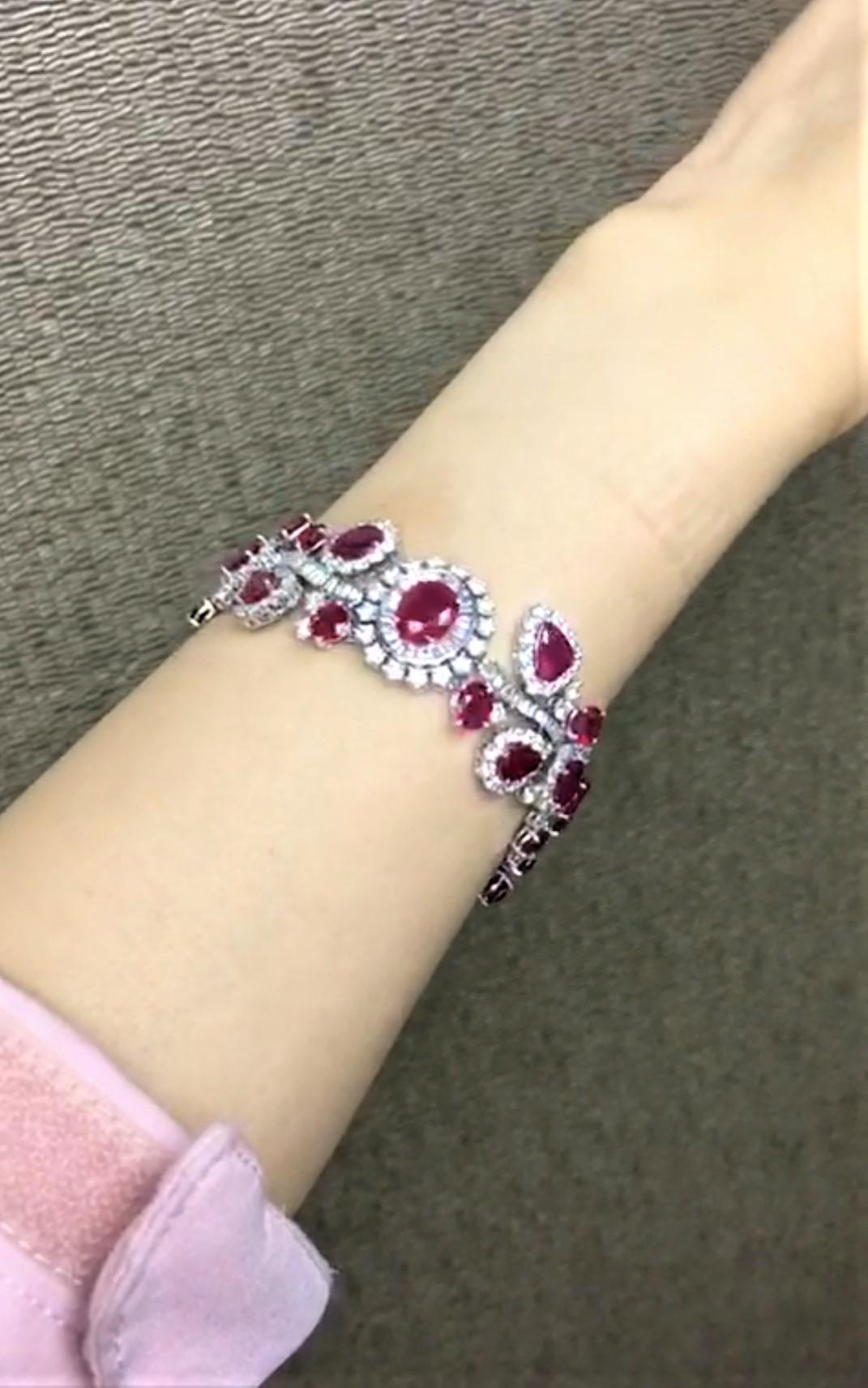 The Following Item we are offering is this Rare Important Radiant 18KT Gold Gorgeous Glittering and Sparkling Magnificent Fancy Rare Burmese Ruby and Diamond Bracelet. Bracelet contains approx 28CTS of Beautiful Fancy Burmese Rubies and Diamonds!!!
