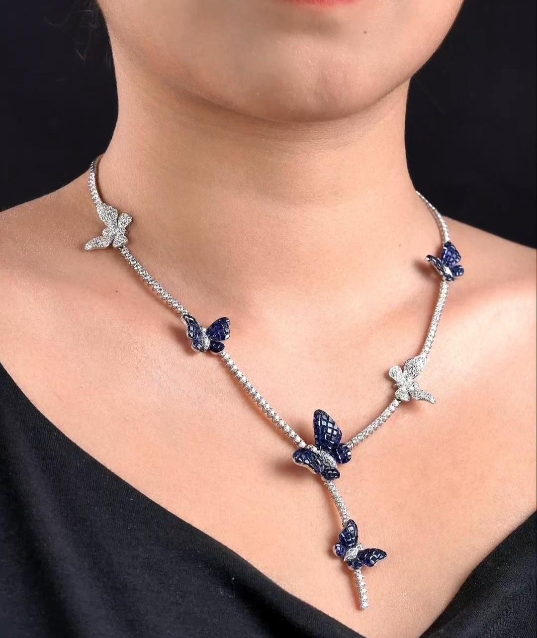
The Following Item we are offering is a Rare Important Radiant 18KT Gold Gorgeous Glittering Butterfly Blue Sapphire and Diamond Necklace. Necklace Feature Gorgeous Colorful Blue Sapphires adorned with Spectacular Glittering Round Diamonds all set