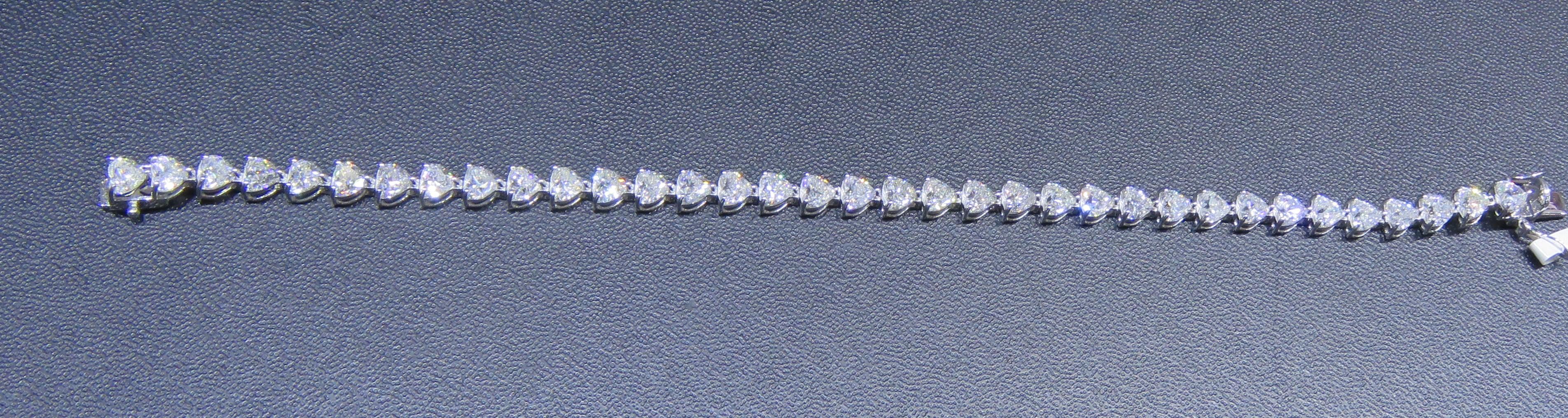 The Following Item we are offering is this Beautiful Rare Important 18KT Gold Sparkling Bracelet Tennis Bracelet. This Rare Bracelet features an Array of Magnificent Rare Diamond Hearts. T.C.W. Approx 11CTS!!
The Diamonds are of Beautiful Fine