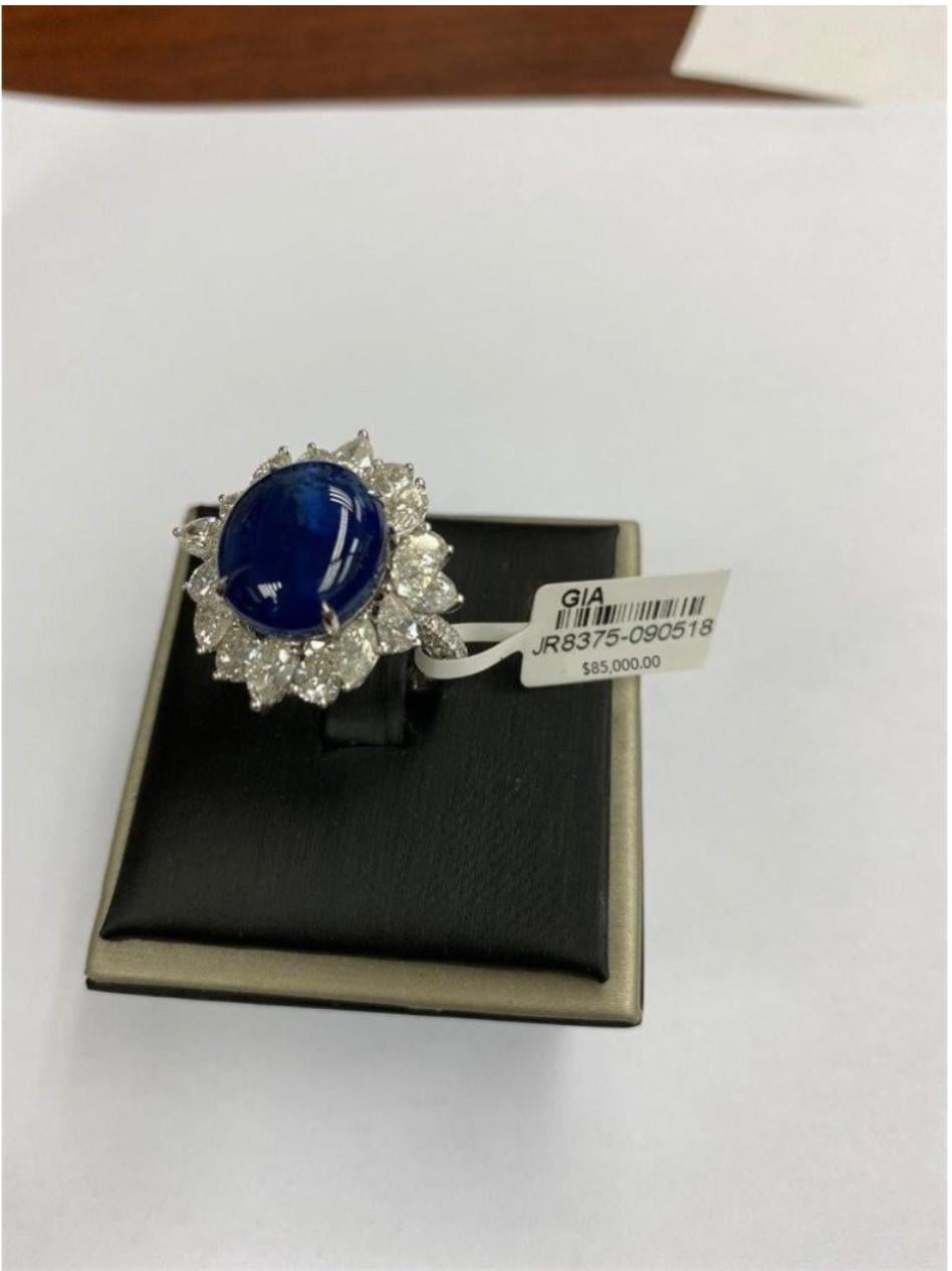 The Following Item we are offering is this Rare Large 18KT GOLD LARGE FANCY OVAL CABOCHON NATURAL NO HEAT EXTREMELY RARE BLUE BURMESE SAPPHIRE AND DIAMOND RING T.C.W. Approx 16CTS!!! This Piece is From a Top Private Manufacturer that sold to