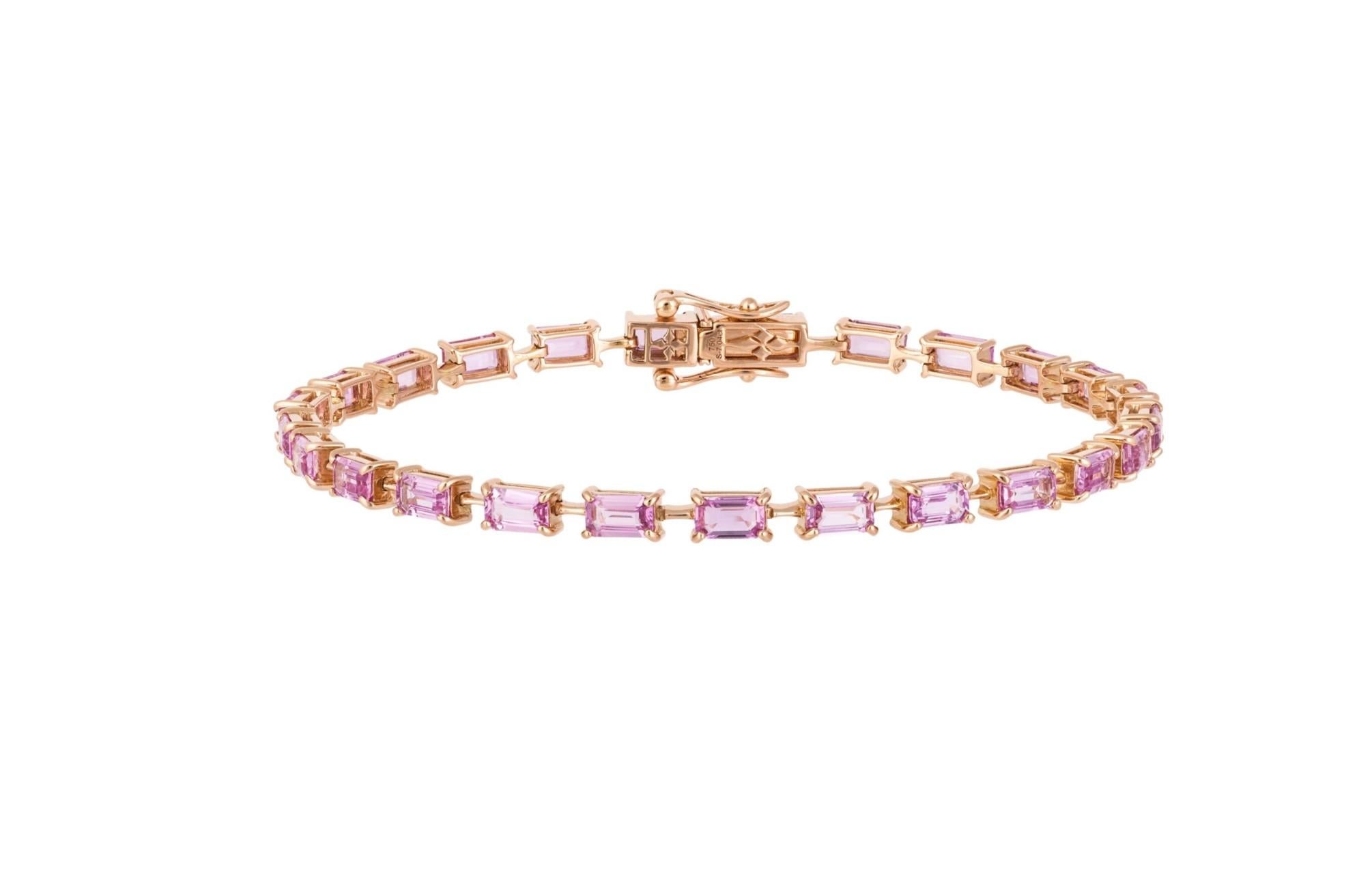 The Following Item we are offering is this Rare Important Radiant 18KT Gold Gorgeous Glittering and Sparkling Magnificent Fancy Emerald Cut Pink Sapphire Tennis Bracelet. Bracelet Contains approx 8.50CTS of Beautiful Fancy Emerald Cut Pink