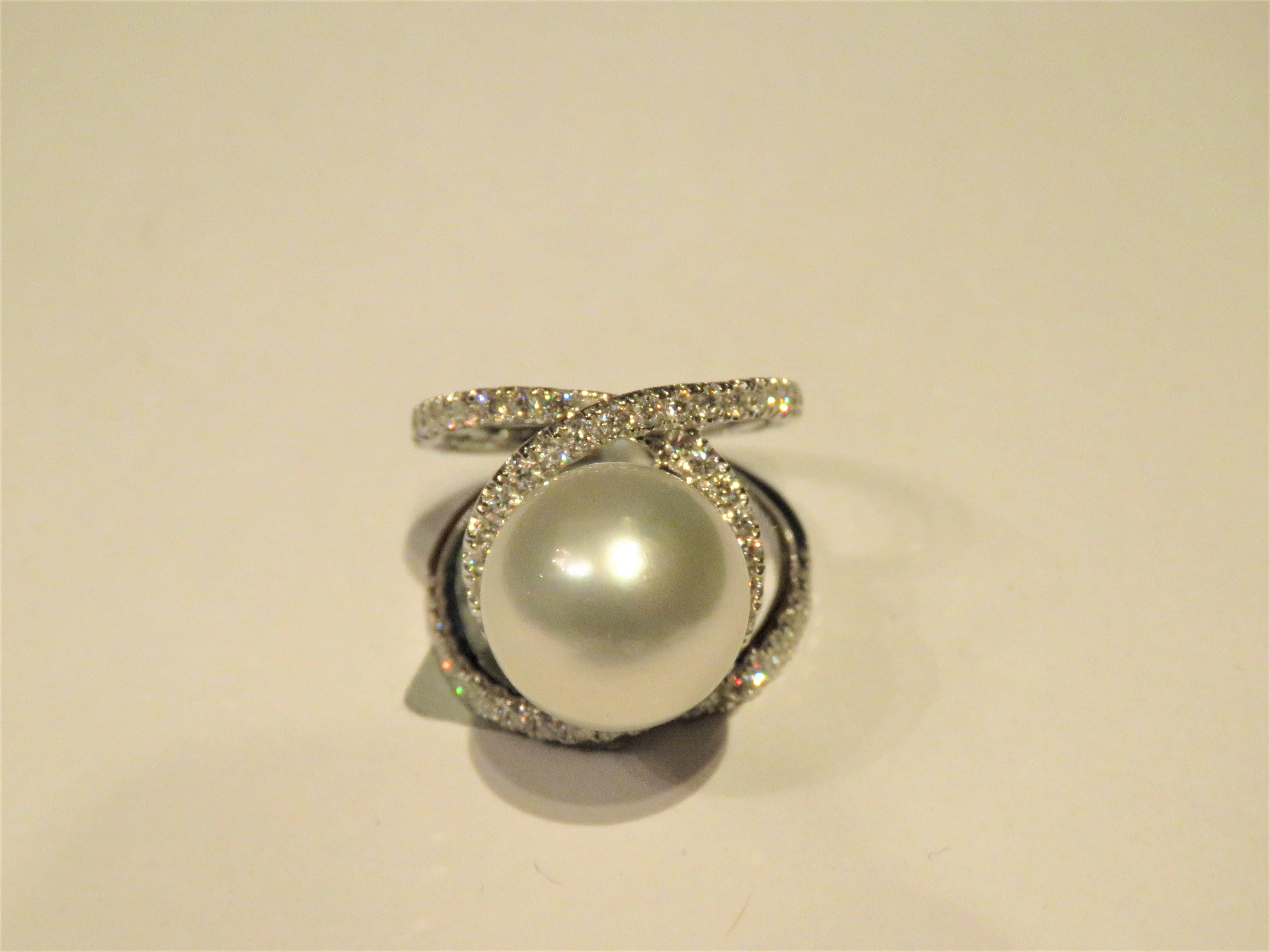The Following Item we are offering is this Extremely Rare Beautiful 18KT Gold Fine Rare Large South Sea Pearl Famcy Diamond Ring. This Magnificent Ring is comprised of a Rare Fine 13MM-14MM Large South Sea Pearl and Round Gorgeous Glittering