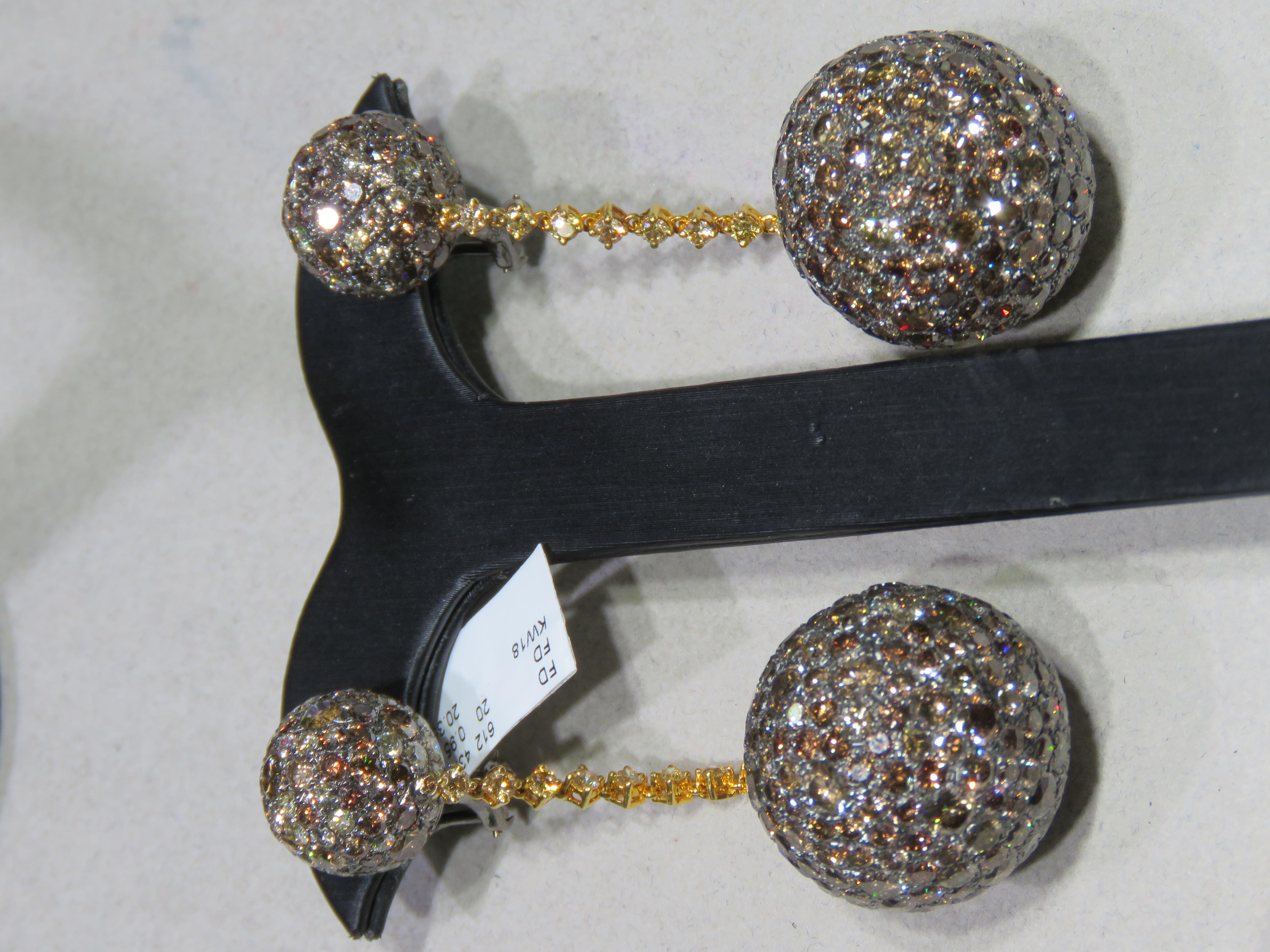 The Following Item we are offering are these Rare Beautiful 18KT Gold Cognac Brown Diamond Disco Ball Drop Earrings. Earrings are comprised of approx. 45 Carats of Fine Glittering Fancy Color Cognac Brown and Yellow Diamond Drop Diamonds. The