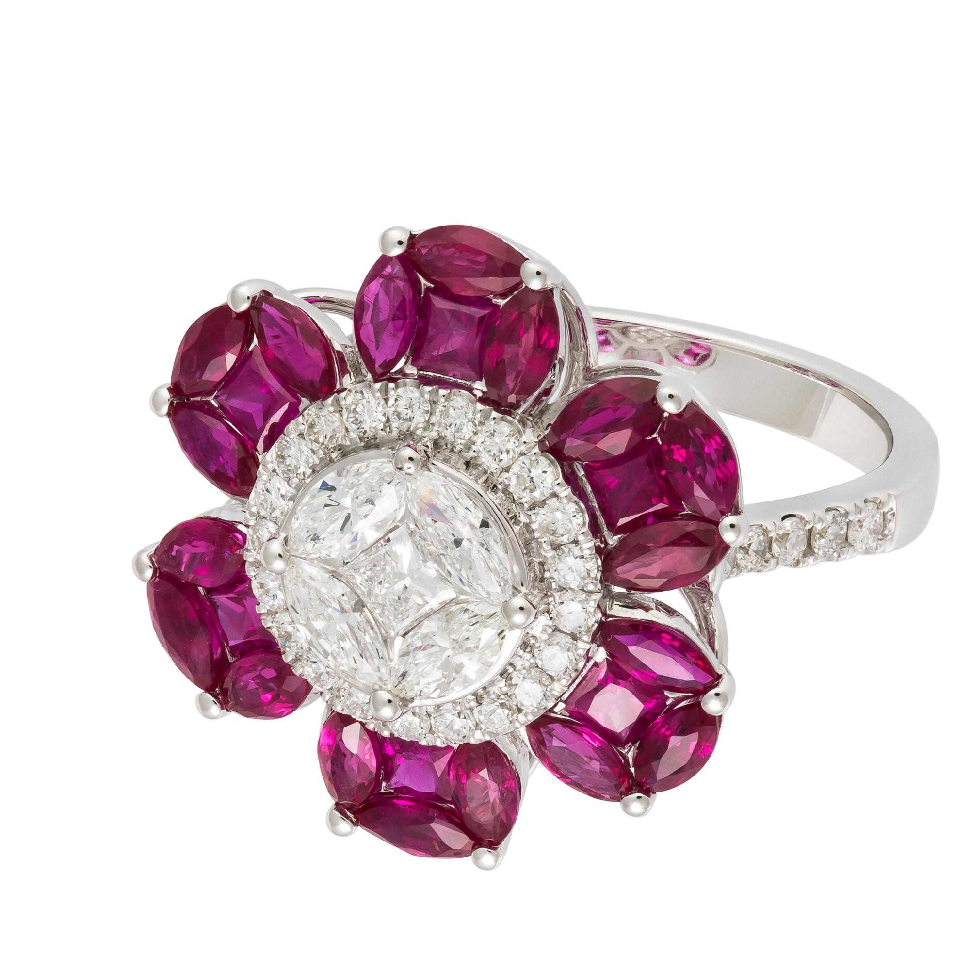 L'article suivant que nous vous proposons est une bague de forme florale en or blanc 18KT rubis diamant rare et importante. La bague est composée de rubis et de diamants finement sertis formant une fleur. T.C.W. Approx 3.50CTS ! !! Les rubis et les