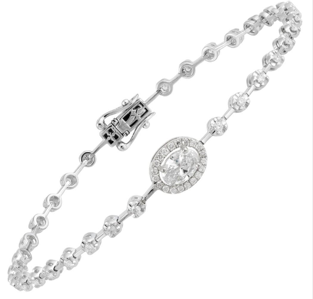 
The Following Item we are offering is a Rare 18KT Gold Oval Shaped Diamond Tennis Bracelet. Bracelet is comprised of Finely Set Gorgeous Glittering Round Diamonds and 1 Large Gorgeous Oval Shaped Diamond with a Halo!!! T.C.W. Over 1CT. The Emeralds