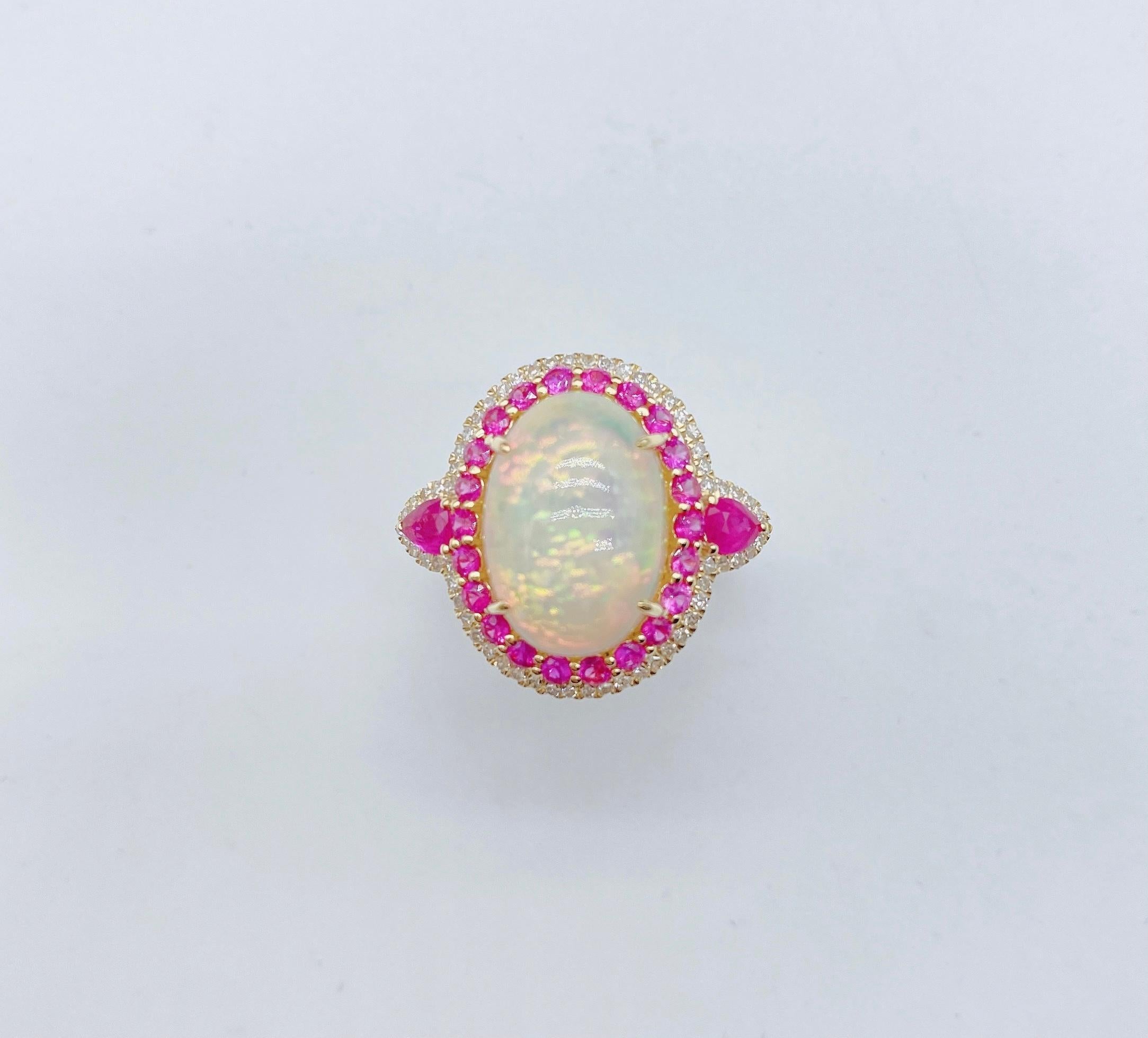 The Following Item we are offering is a Rare Important Radiant 18KT Gold Large Fancy Fiery White Opal Diamond Ruby Ring. Ring is comprised of A LARGE Gorgeous Fancy Fiery White Opal surrounded by a Beautiful Halo of Glittering Diamonds and Rubies