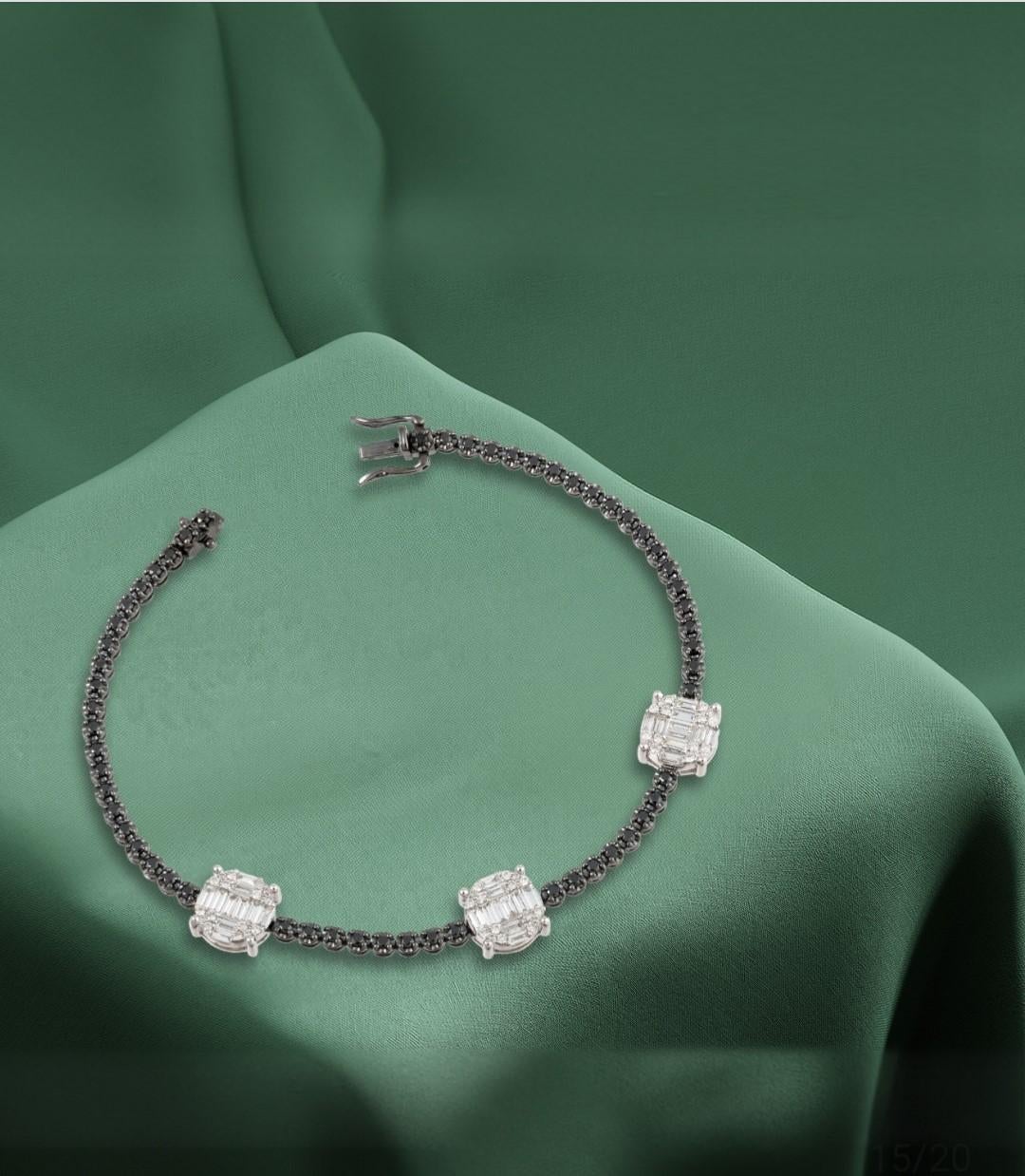 The Following Item we are offering is a Important Radiant 18KT Gold Rare Fancy Gorgeous Black Diamond White Diamond Tennis Bracelet. Bracelet is comprised of Fancy Black Diamonds interlocking with 3 Large White Diamond Clusters. T.C.W. Approx