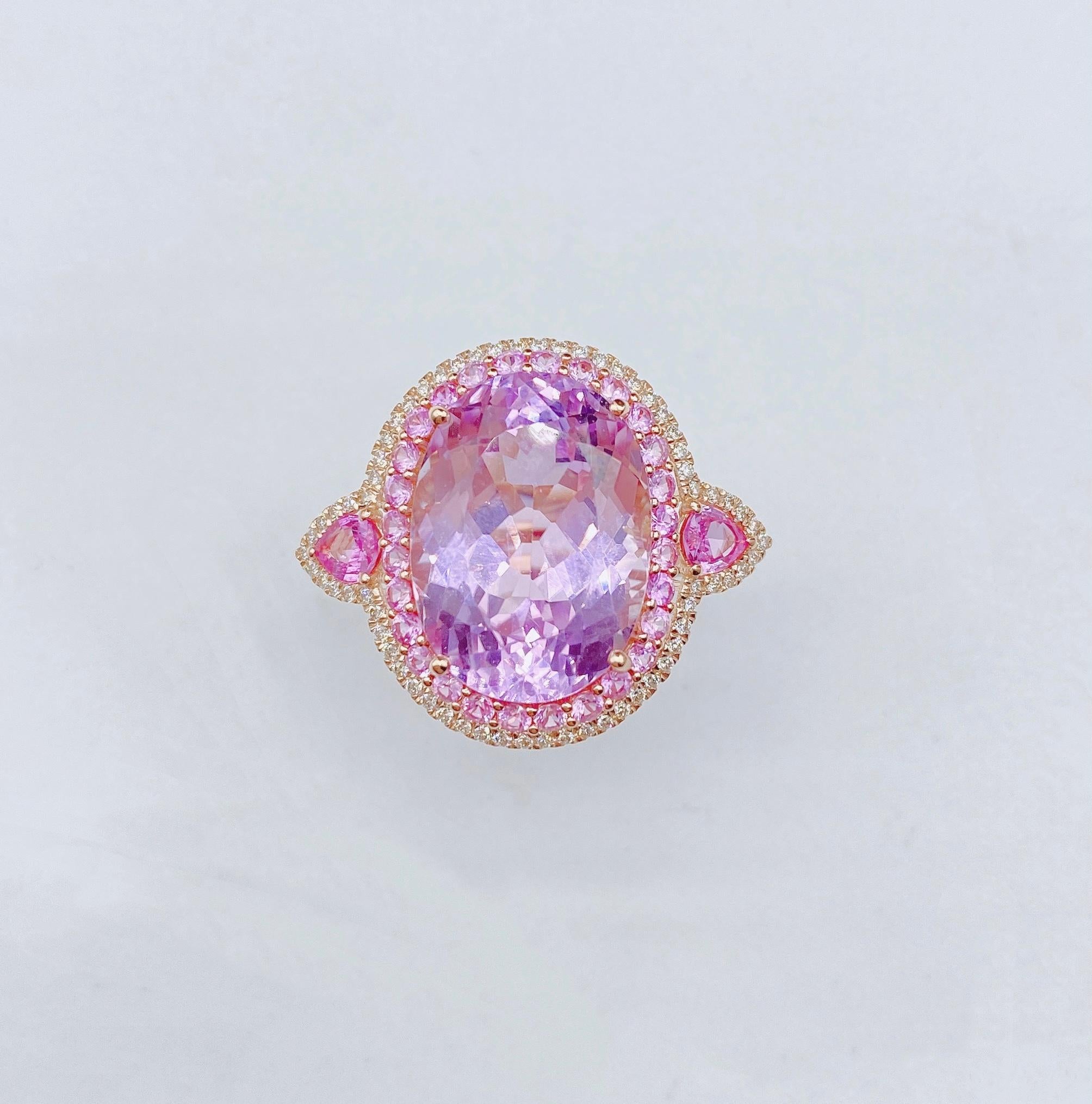 The Following Item we are offering is a Rare Important Radiant 18KT Gold Large Fancy Kunzite Ring. Ring is comprised of A LARGE Gorgeous Fancy Kunzite surrounded by a Beautiful Halo of Glittering Diamonds and Pink Sapphires and Pink Sapphire