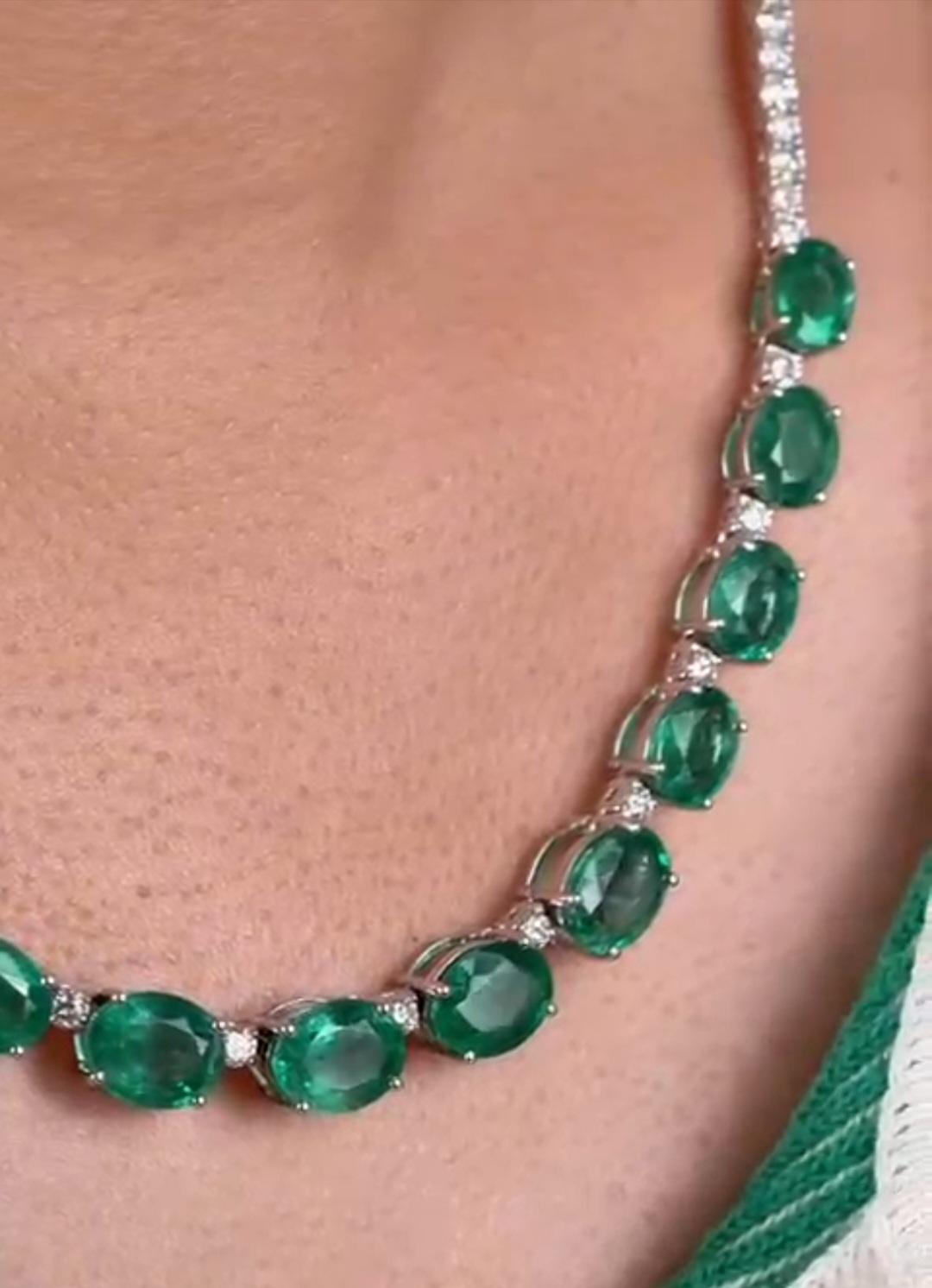 The Following Item we are offering is a Rare Important Estate Radiant 18KT Yellow Gold Necklace with Magnificent Large Fancy Oval Cut Emeralds Flanked by Fine Glittering White Diamonds Throughout. T.C.W. approx 35CTS!!!  
This Gorgeous Necklace is a