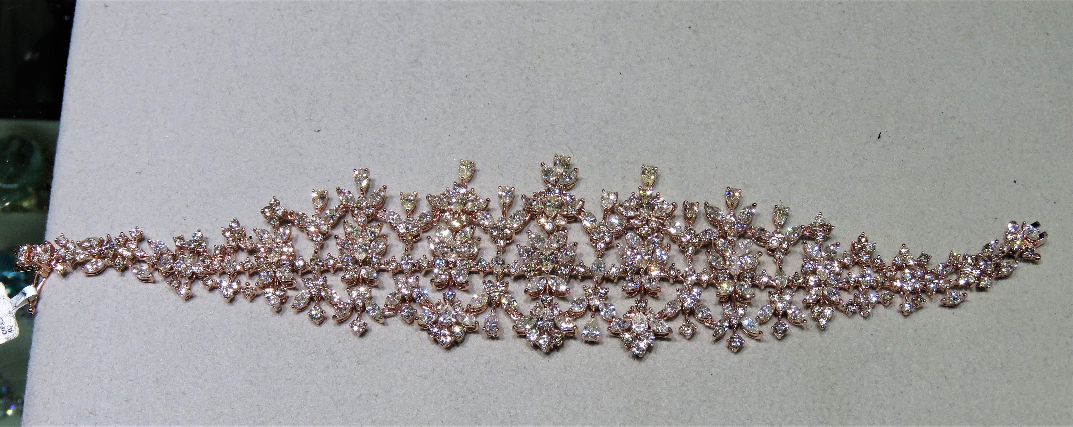 The Following Item we are offering is this Extremely Rare Beautiful 18KT Gold Fine Rare Large Wide Fancy Diamond Cluster Bracelet. This Magnificent Bracelet is comprised of Rare Fine Fancy Diamonds in the Form of Flowers!!! T.C.W. Approx 20CTS!!