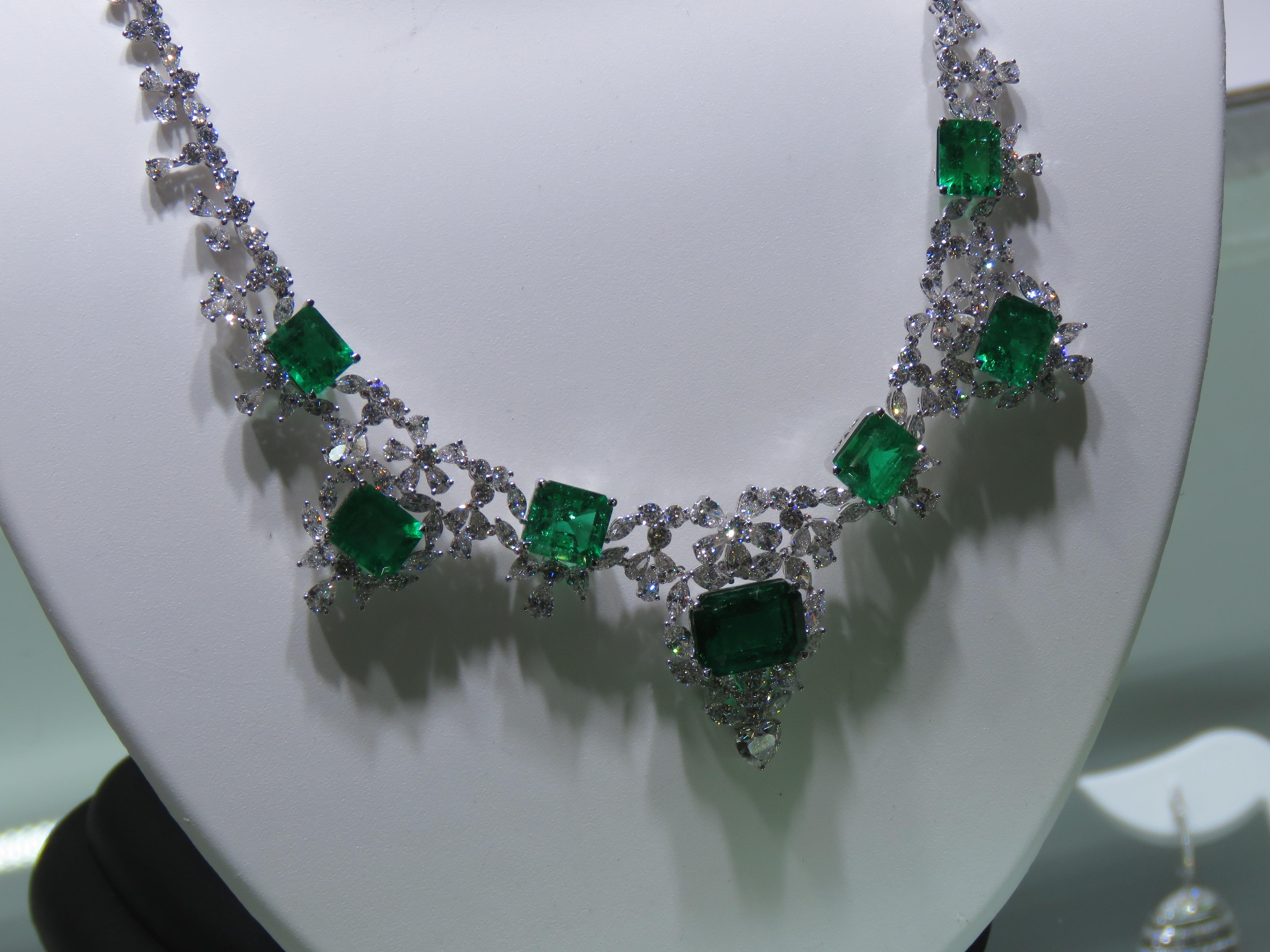 The Following Item we are offering is this Rare Important Radiant 18KT Gold Gorgeous Glittering and Sparkling Magnificent Fancy Cut Rare GIA GRS Certified Colombian Emeralds and Diamond Necklace. Necklace contains approx 45CTS of Beautiful Fancy
