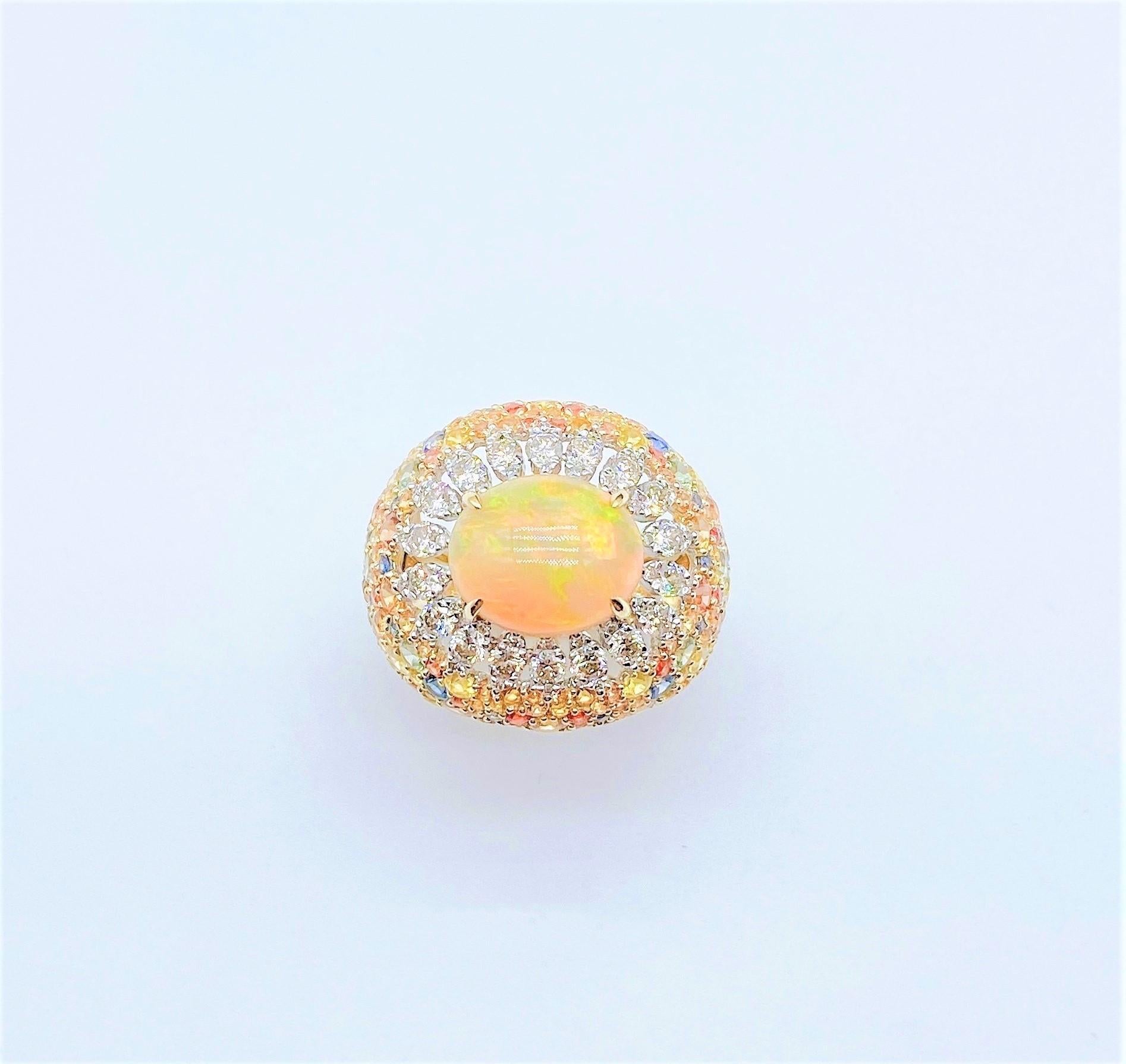 The Following Item we are offering is a Rare Important Radiant 18KT Gold Large Fancy Fiery White Opal Diamond Multi Sapphire Ring. Ring is comprised of A LARGE Gorgeous Fancy Fiery White Rainbow Opal surrounded by Beautiful Glittering Diamonds and