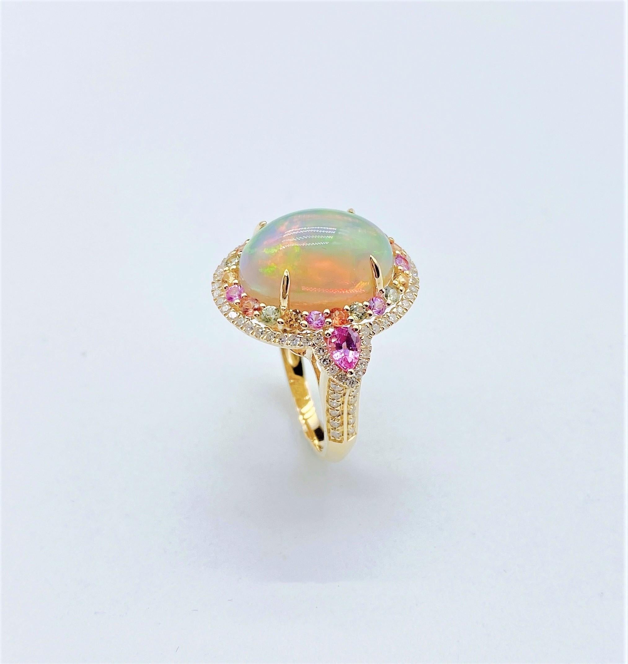 The Following Item we are offering is a Rare Important Radiant 18KT Gold Large Fancy Fiery White Opal Diamond Pink Sapphire Ring. Ring is comprised of A LARGE Gorgeous Fancy Fiery White Rainbow Opal surrounded by a Beautiful Halo of Fancy Rainbow