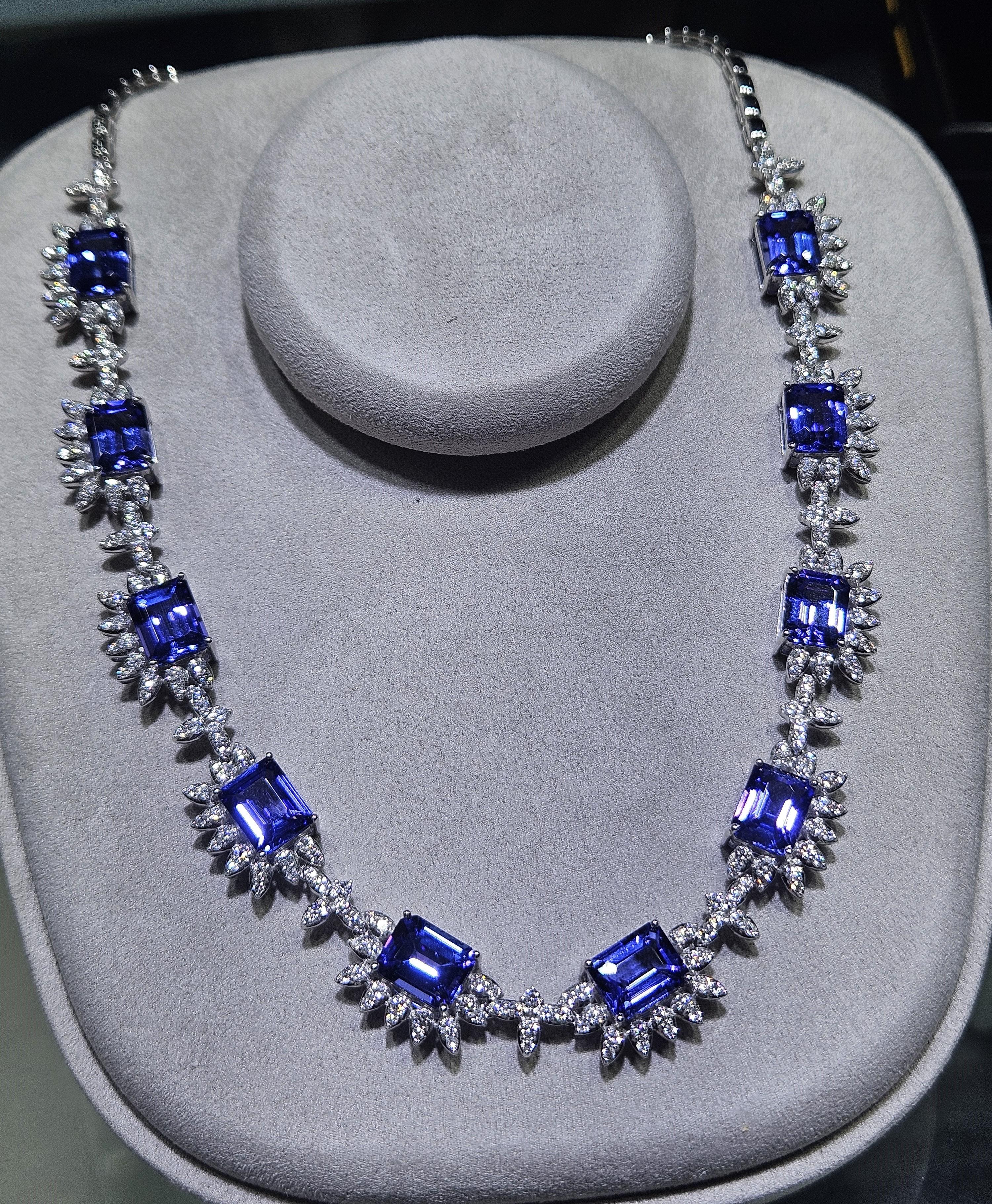 The Following Item we are offering is this Rare Important Radiant 18KT Gold Gorgeous Glittering and Sparkling Magnificent Fancy Cut Tanzanite and Diamond Necklace. Necklace contains approx 14.50CTS of Beautiful Fancy Oval Cut Tanzanites and
