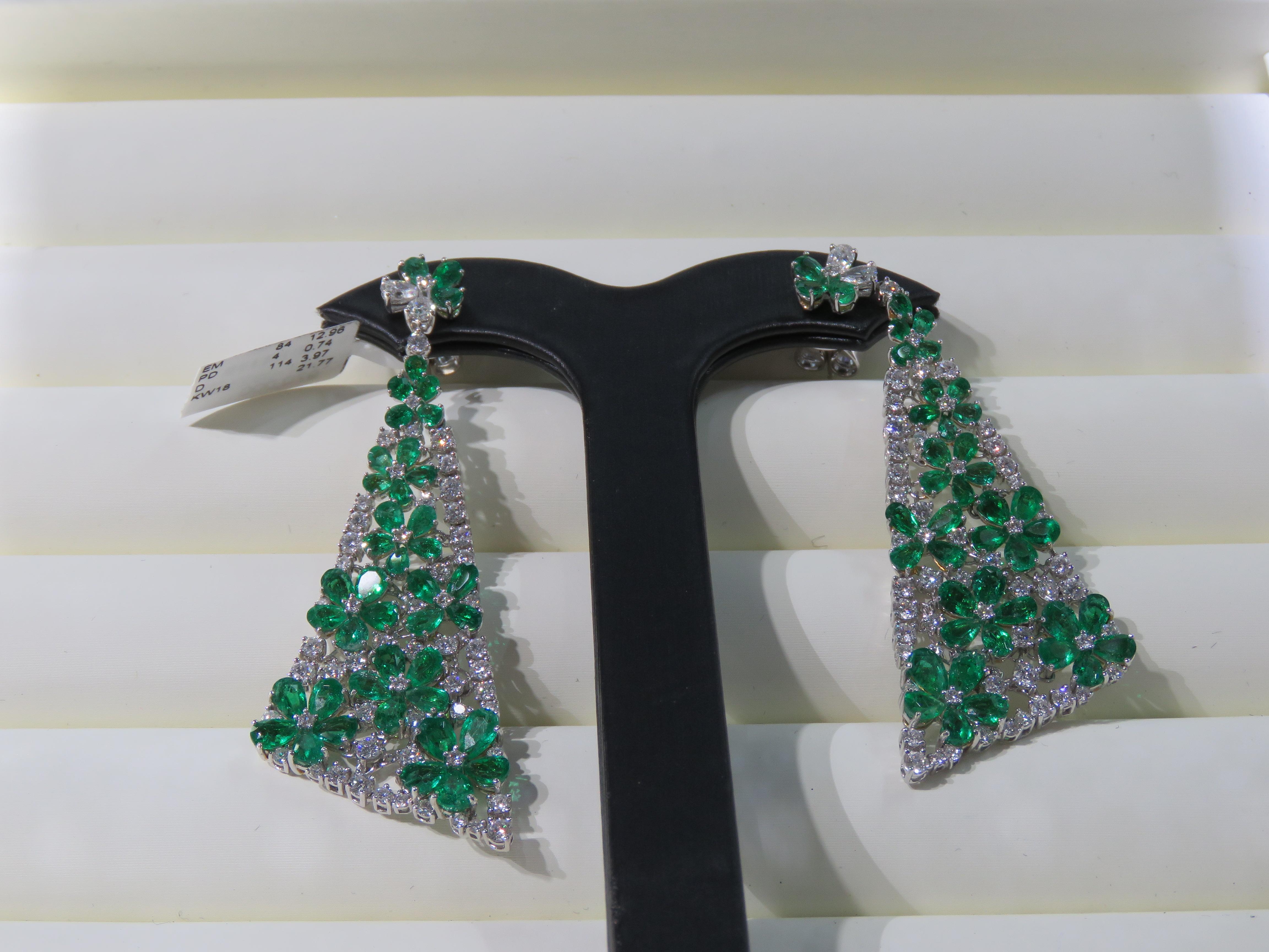 The Following Item we are offering is this Rare Important Radiant 18KT Gold Gorgeous Glittering and Sparkling Magnificent Fancy Colombian Emerald and Diamond Dangle Earrings. Earrings Contains approx 18CTS of Beautiful Fancy Cut Colombian Emeralds