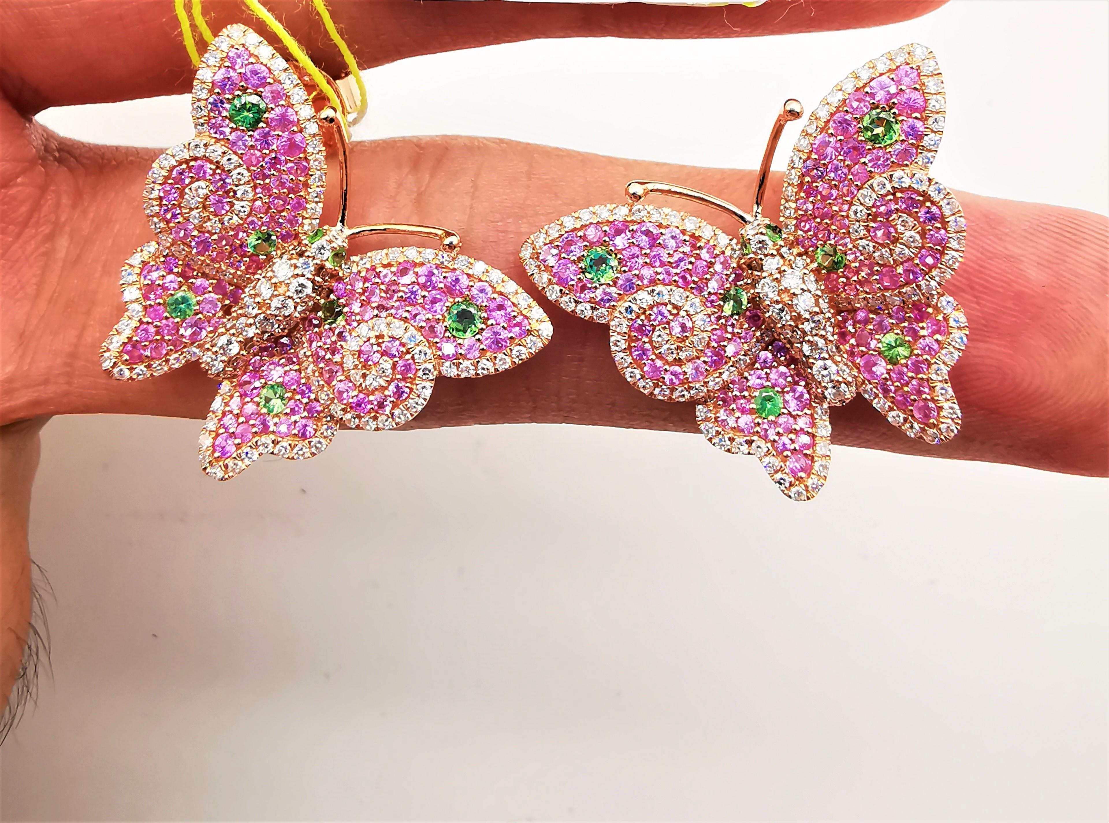 
The Following Items we are offering is a Rare Important Radiant 18KT Yellow Gold and 18KT Gold Gorgeous Glittering Pink Sapphire and Tsavorite Butterfly Diamond Earrings. Earrings  Feature Gorgeous Colorful Pink Sapphires adorned Spectacular