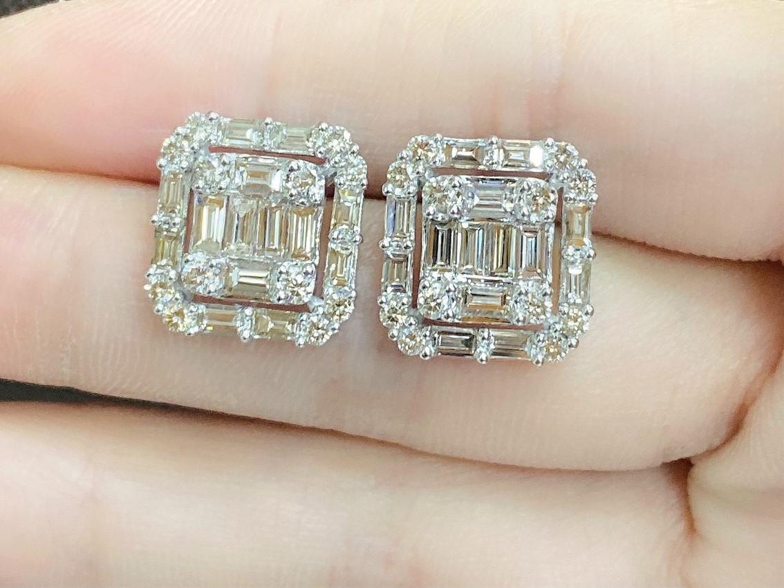 The Following Items we are offering is a Rare Important Radiant Pair of 18KT GOLD LARGE DIAMOND BAGUETTE STUD EARRINGS. Earrings are comprised with Gorgeous Glittering Finely Set Sparkling Baguette and Round Diamonds. Each Framed with a Magnificent