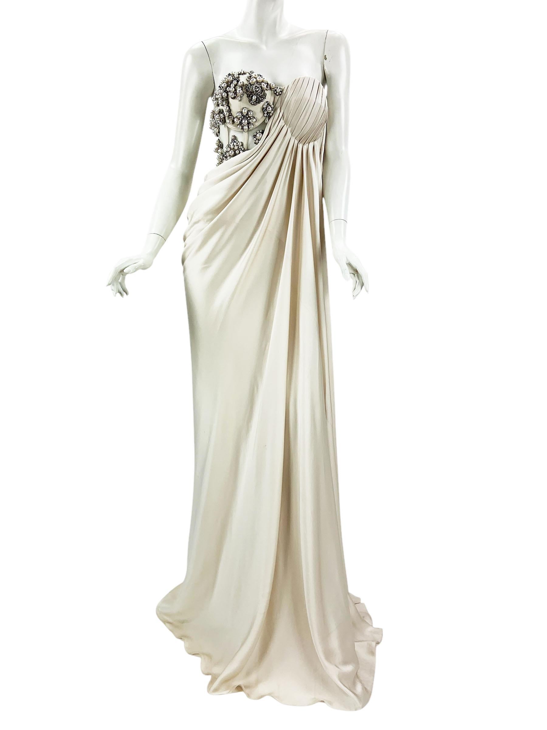 NWT Alexander McQueen  Cream Pearl Satin Corset Embellished Dress Gown
S/S 2021 Collection
Italian size - 40
Crafted from sumptuous cream pearl color satin, Corset is punctuated with hand-applied Swarovski crystals and pearls-like beads. This