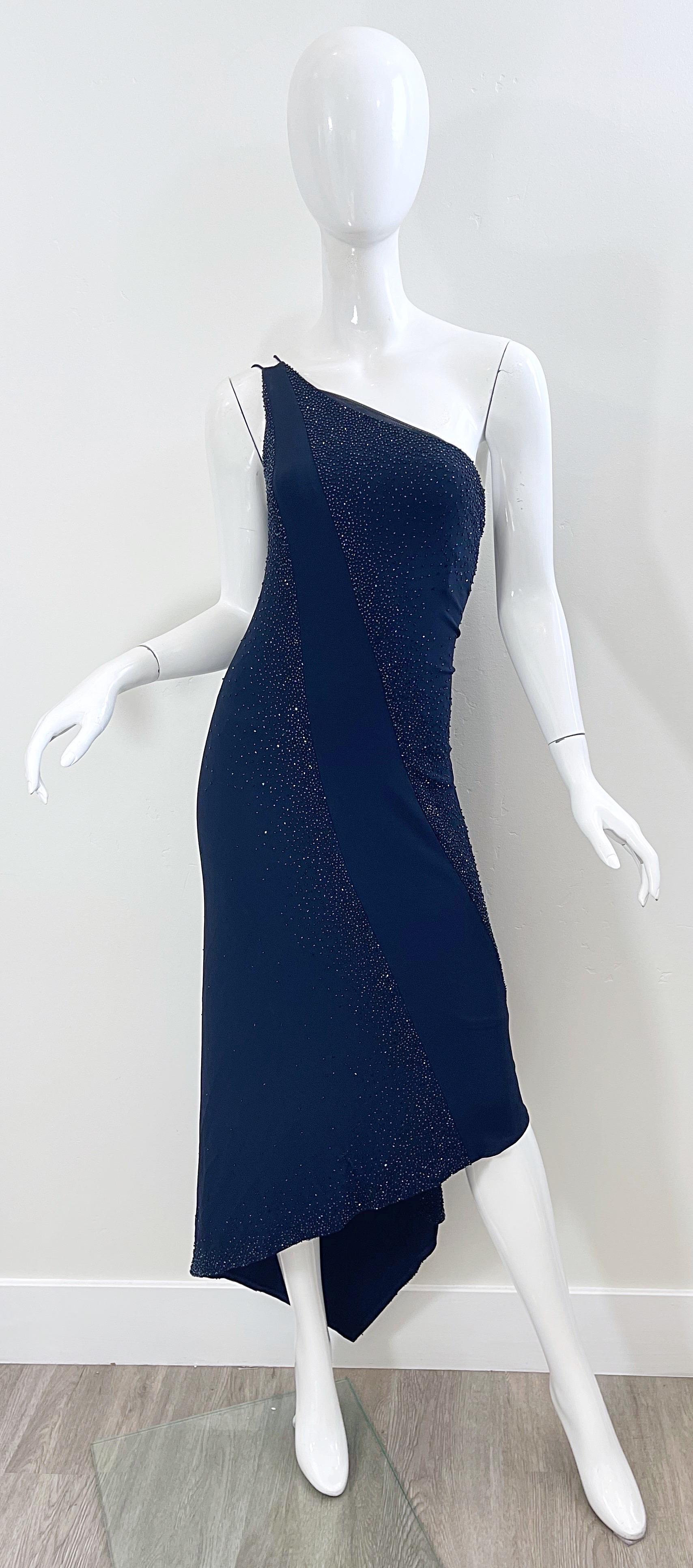Beautiful brand new with tags dead stock DONNA KARAN 90s navy blue one shoulder handkerchief hem beaded dress ! Features a Rayon ( 95% ) and Spandex ( 5% ) fabric blend that stretches to fit. Two straps on the right shoulder with mesh details.