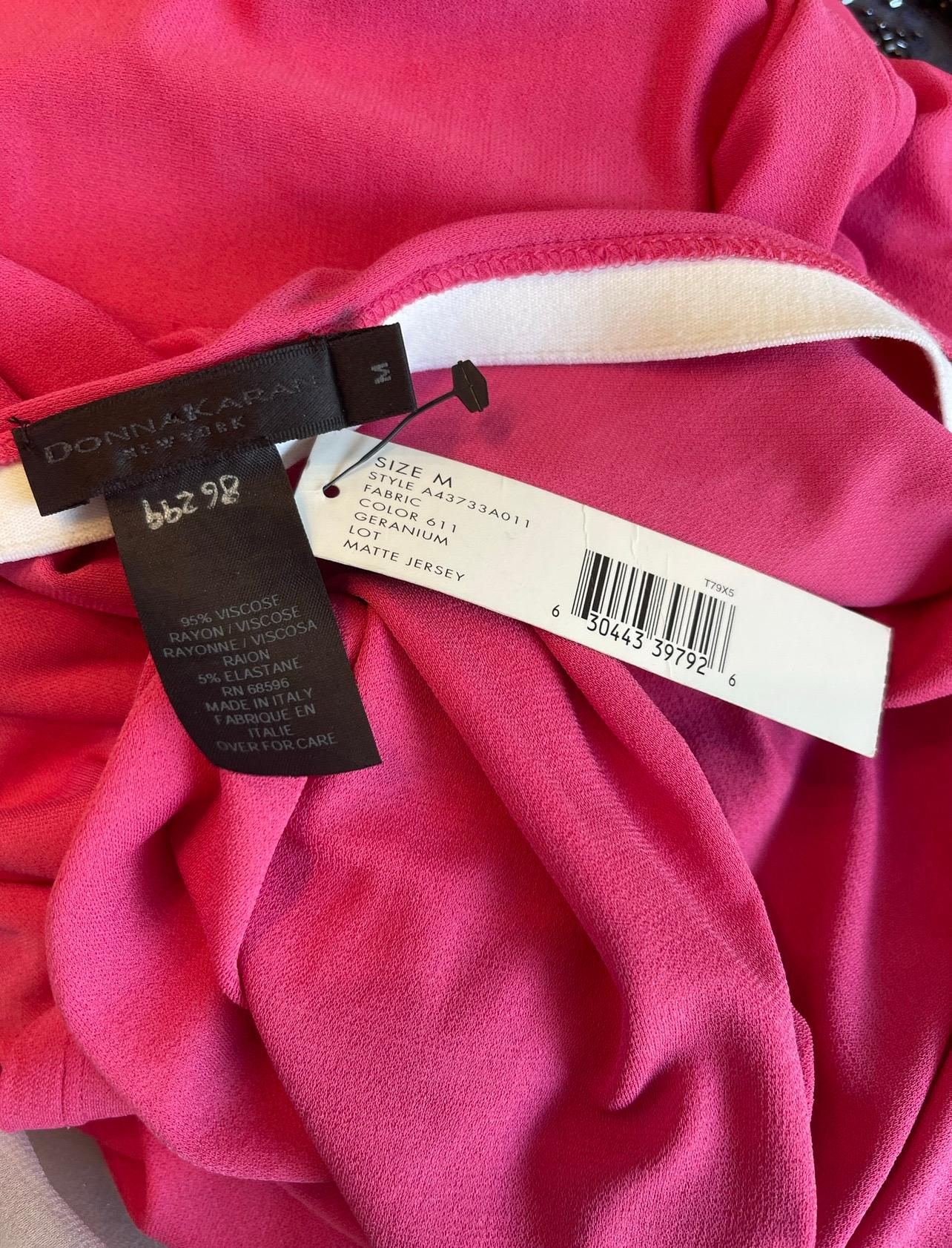 Chic new with tags DONNA KARAN hot pink strapless tube dress ! This is actually from Karan’s final collection before her retirement. Attached tube slips over the head when the dress is put on. Simply slips over the head and stretches to fit. Soft