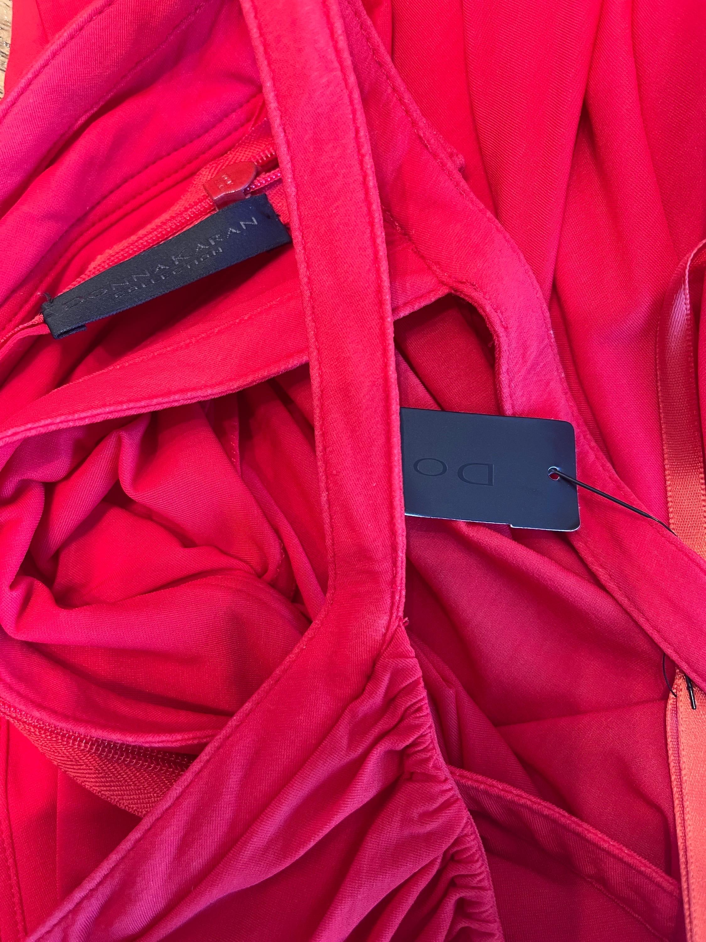 Brand new with original $2,395 tags DONNA KARAN Spring 2006 red bubble hem Grecian dress ! Features the prettiest shade of lipstick red. Soft Cupro (81%) and Spandex (19%) fabric has plenty of stretch. Attached tie belt ties at center back. Hidden