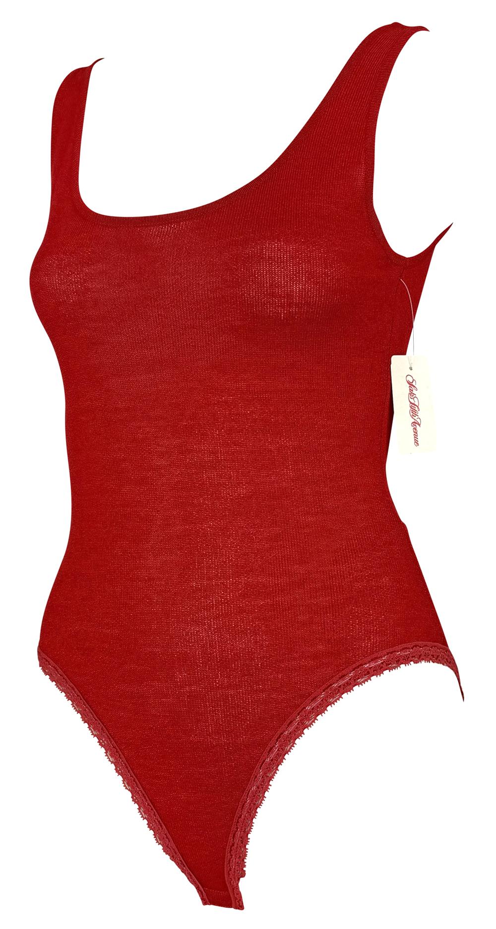 This new with tags early 1990s Donna Karan red knit bodysuit features a sleek, form-fitting design with a scoop neckline and lace-trimmed leg openings.

Approximate measurements:
Size - P
Bust: 29