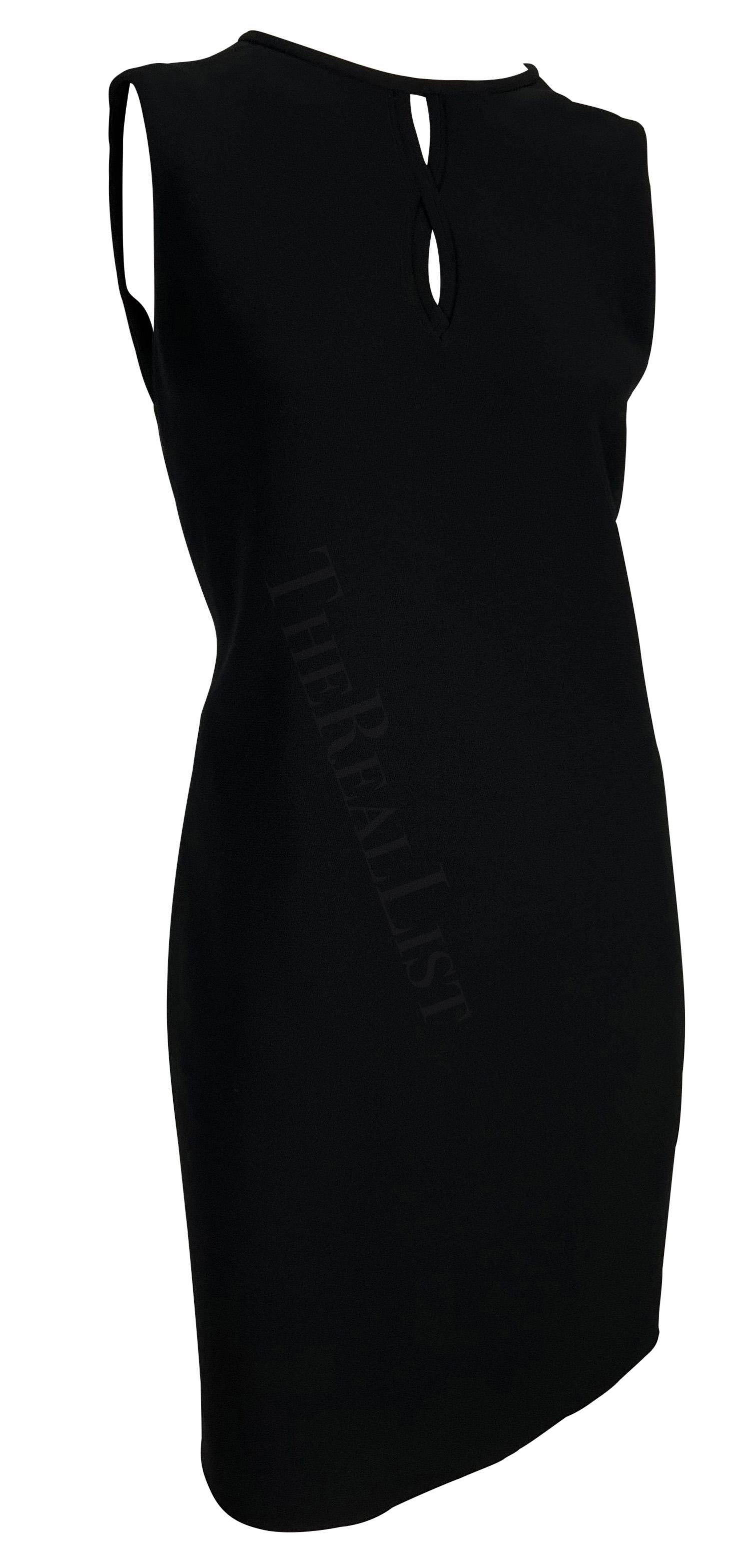 Presenting a fabulous black Gianni Versace tunic dress, designed by Gianni Versace. From the Fall/Winter 1997 collection, this chic sleeveless LBD features a crew neckline and cutouts between the breasts. Never worn before, this dress comes with the