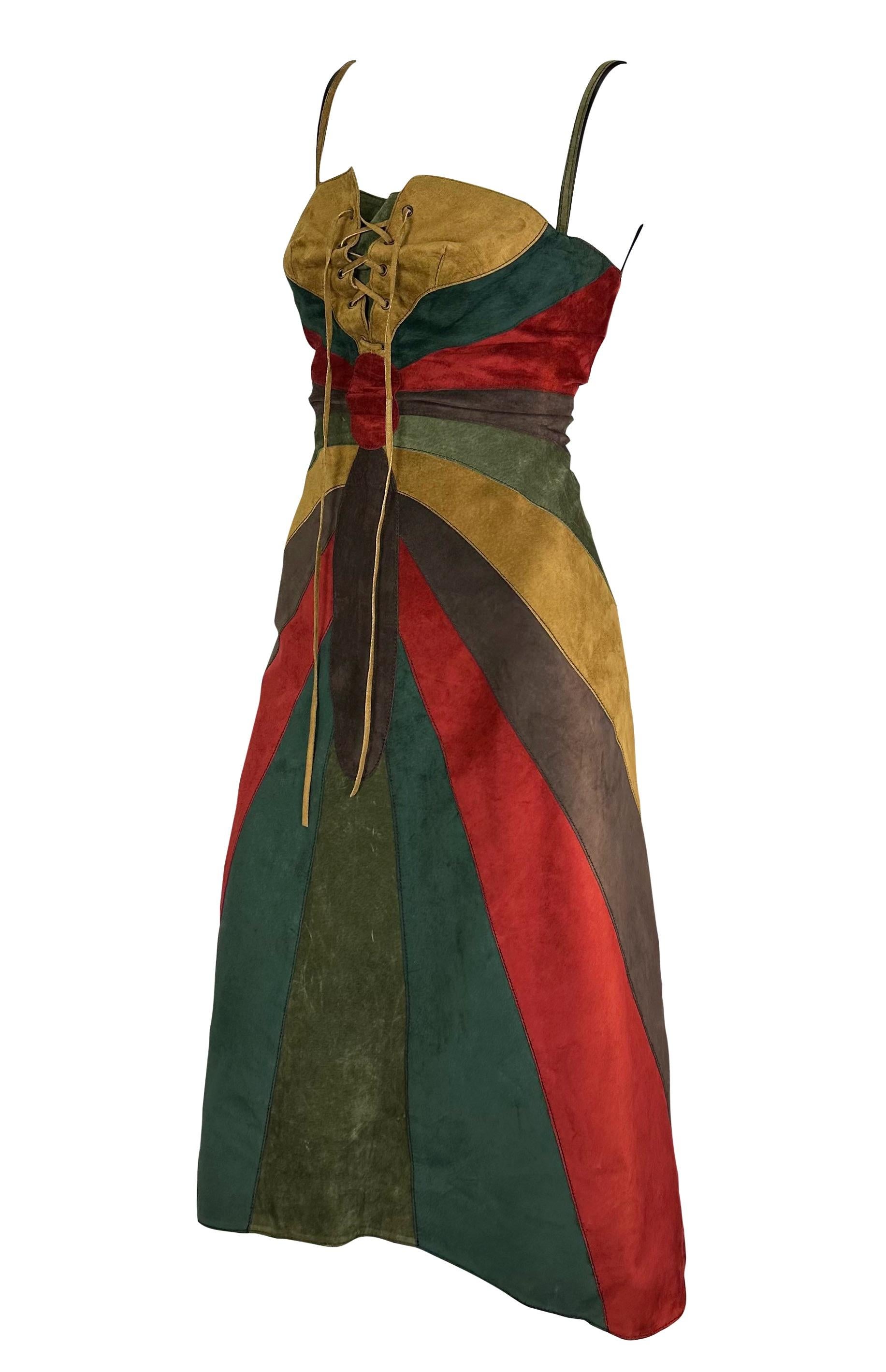 TheRealList presents: a beautiful multicolored suede panel Dolce and Gabbana dress. From the Fall/Winter 2002 collection, this entirely suede dress is constructed of color-blocked suede panels that form to create a butterfly pattern. The dress