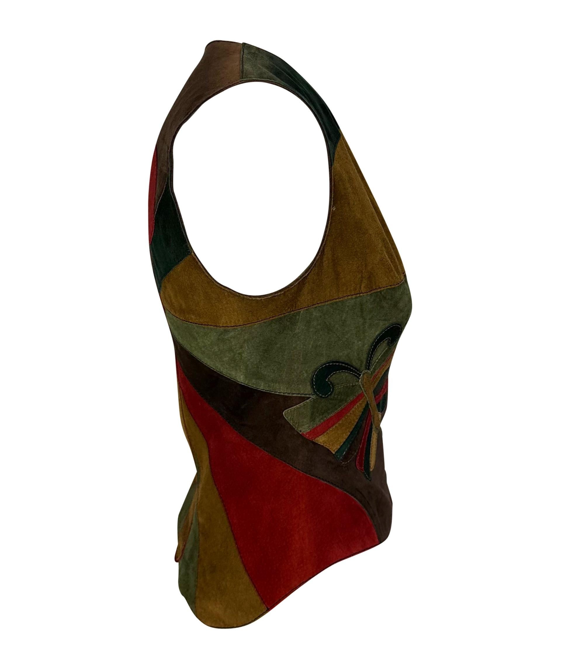 Presenting a fabulous color block  Dolce and Gabbana suede butterfly vest. From the Fall/Winter 2002 collection, this vest features multicolor suede panels sewn together to create a large butterfly on the back with the design of the wings being