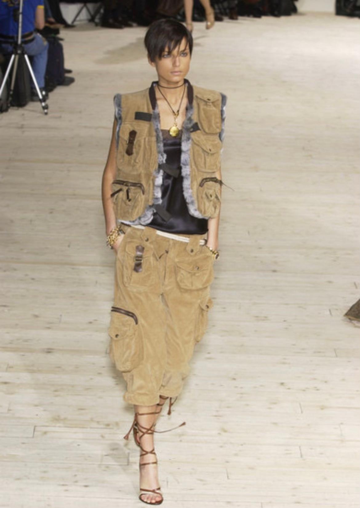 Presenting a tan corduroy lapin-lined Dolce and Gabbana vest. From the Fall/Winter 2002 collection, this vest debuted on the season's runway as part of Look 27, modeled by Irina Bondarenko. This fabulous vest perfectly combines utility and luxury.