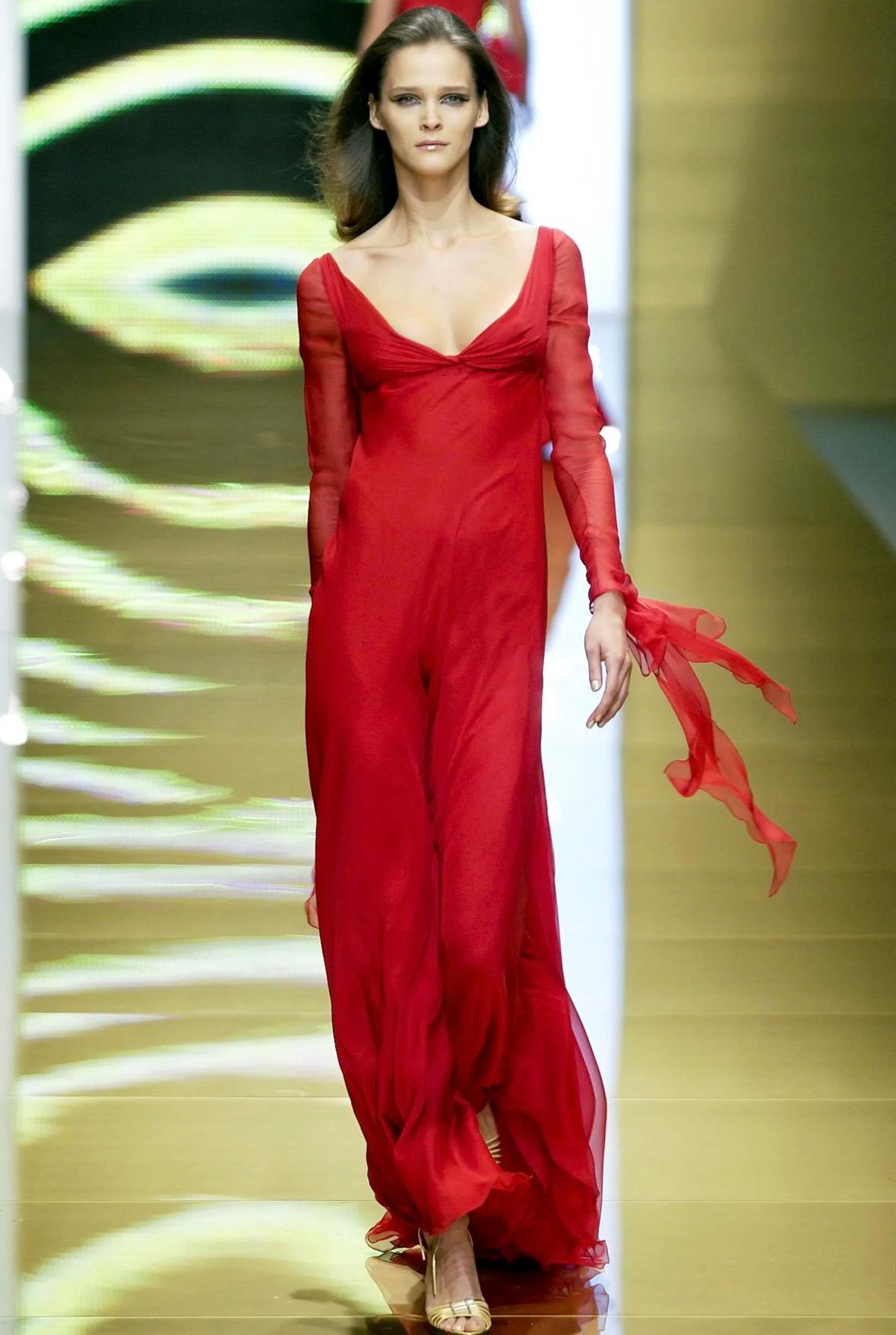 Presenting a striking chiffon evening gown designed by Valentino Garavani for his Fall/Winter 2002 collection. The dress debuted as the runway presentation's grand finale on Carmen Kass. Glamorous draped chiffon accents at the cuffs and back create