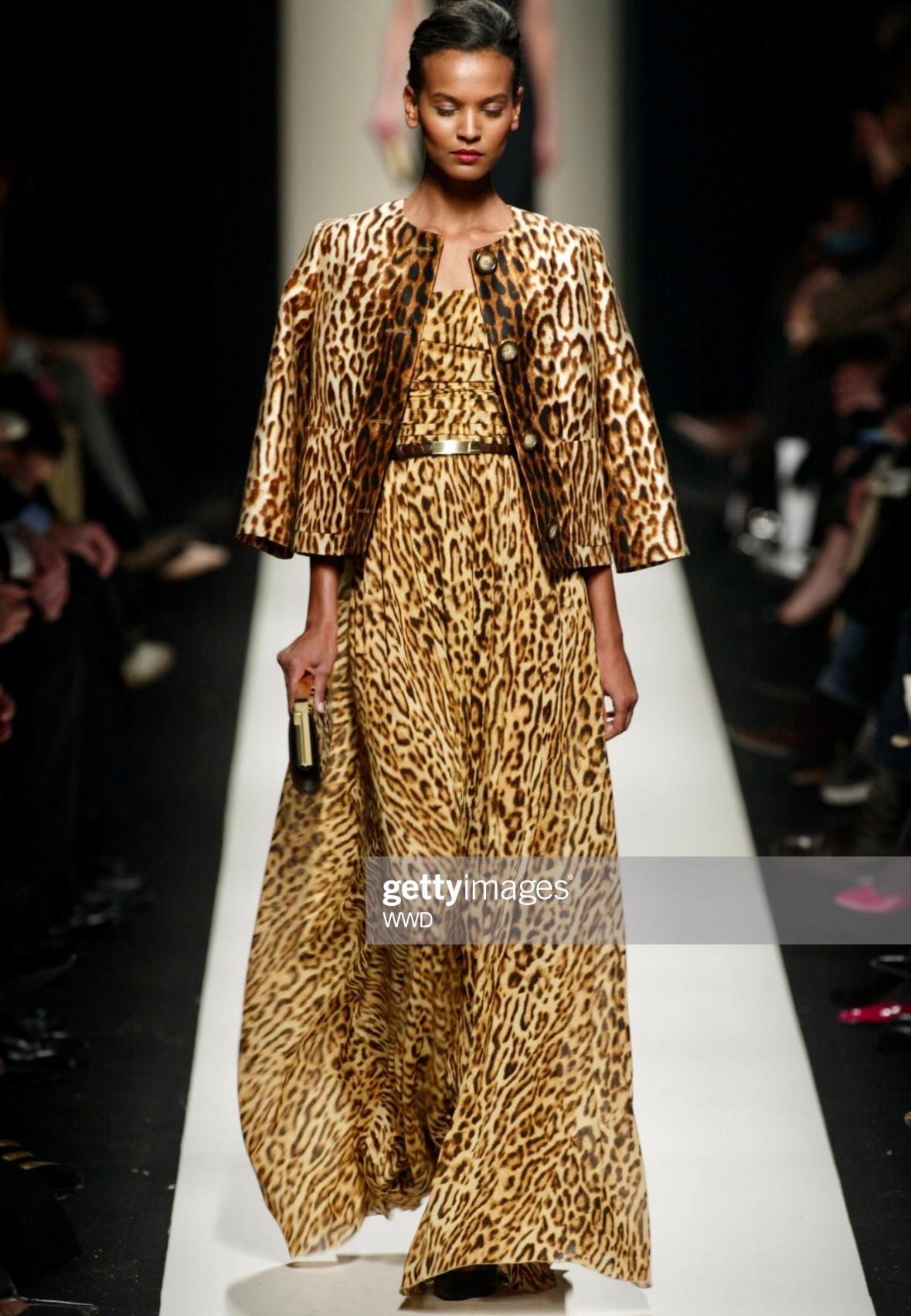 Presenting a beautiful cheetah print Celine gown, designed by Michael Kors. From the Fall/Winter 2004 collection, this strapless dress debuted on the season's runway and features a ruched bust and internal corset. The full-length dress is made