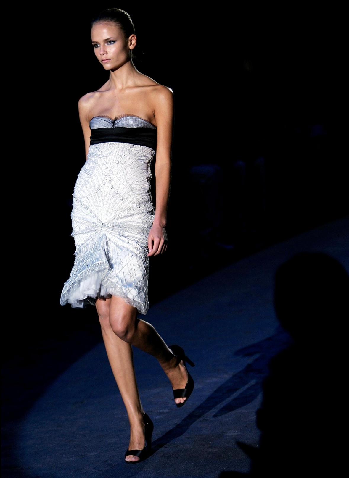 Presenting an incredible silver and black embroidered strapless Gucci dress, designed by Alessandra Facchinetti. From the Fall/Winter 2005 collection, this dress debuted as part of look 38 modeled by Natasha Poly and was also highlighted in the