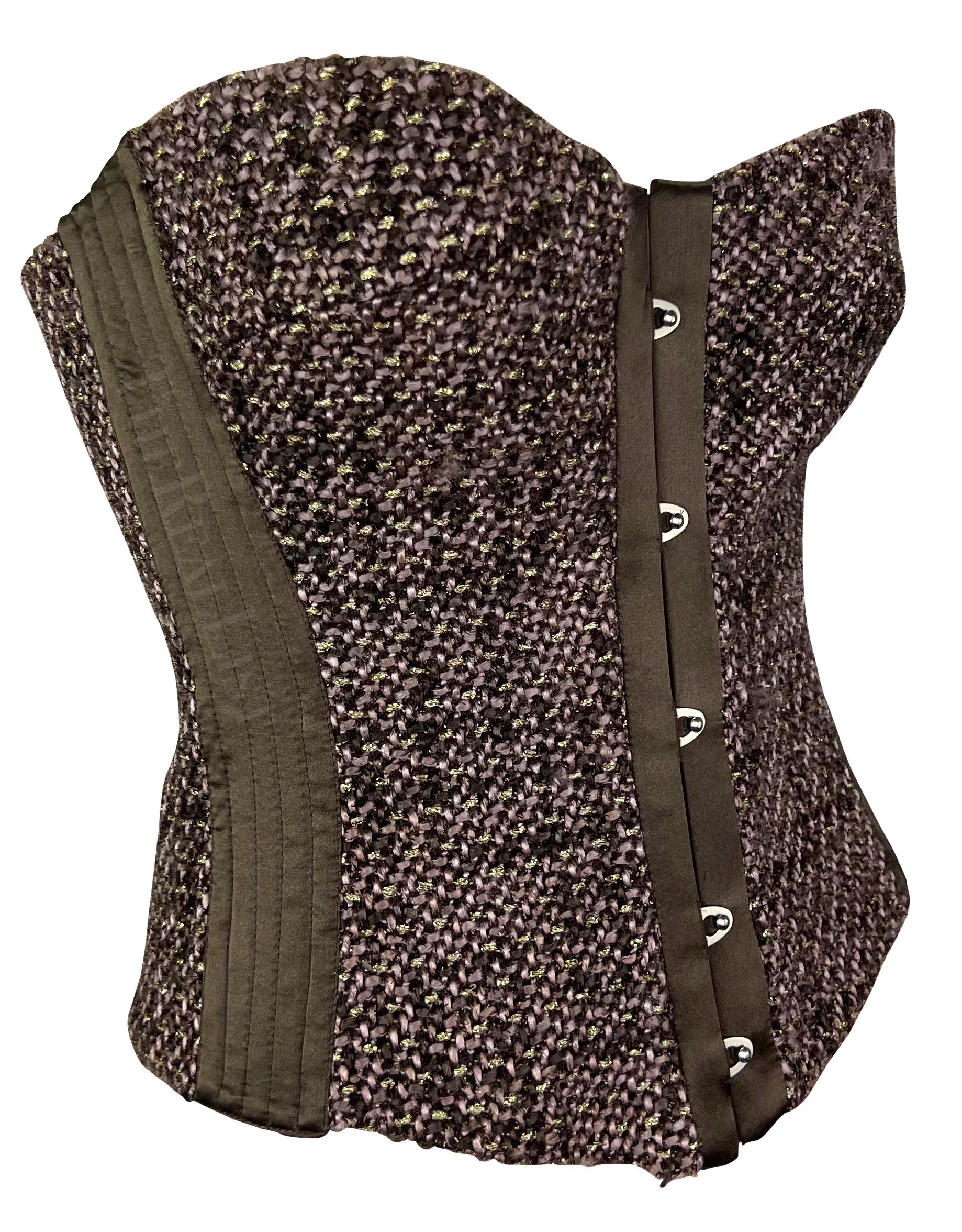 Presenting a brown tweed Roberto Cavalli tweed corset top. From the Fall/Winter 2005 collection, this top is constructed of gorgeous brown tweed, this steel-boned corset features a hook and eye closure at the front, and lace-up detail at the back.