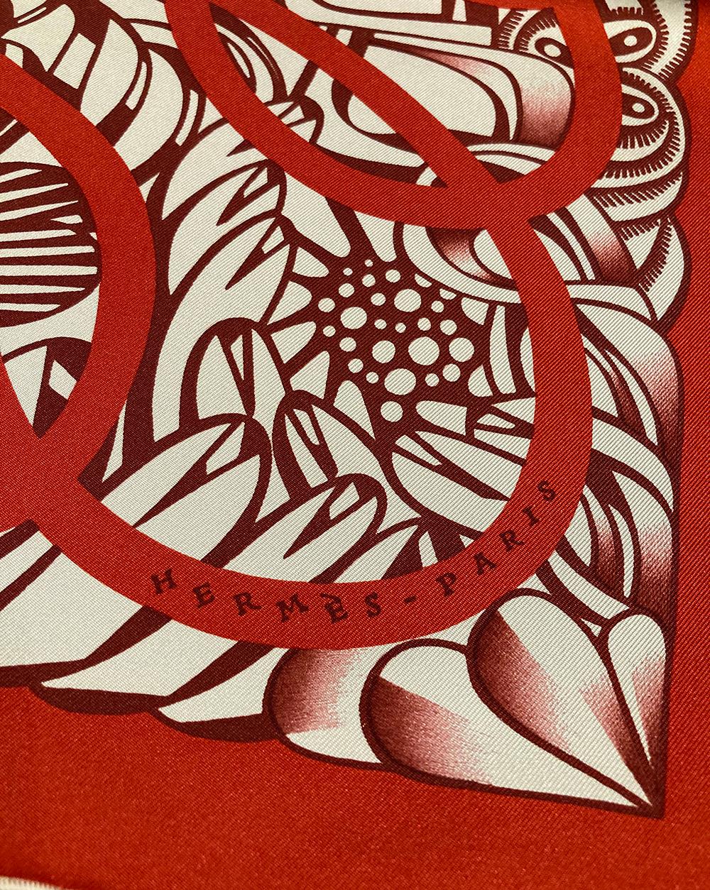 NWT Hermes Reverie Solitaire Silk Scarf in new unused condition. Silk screen design c2019 by Florence Manlik. Bright red main color with black and red illustrated floral print behind. 100% silk. white hand rolled hem. made in france. tag attached.