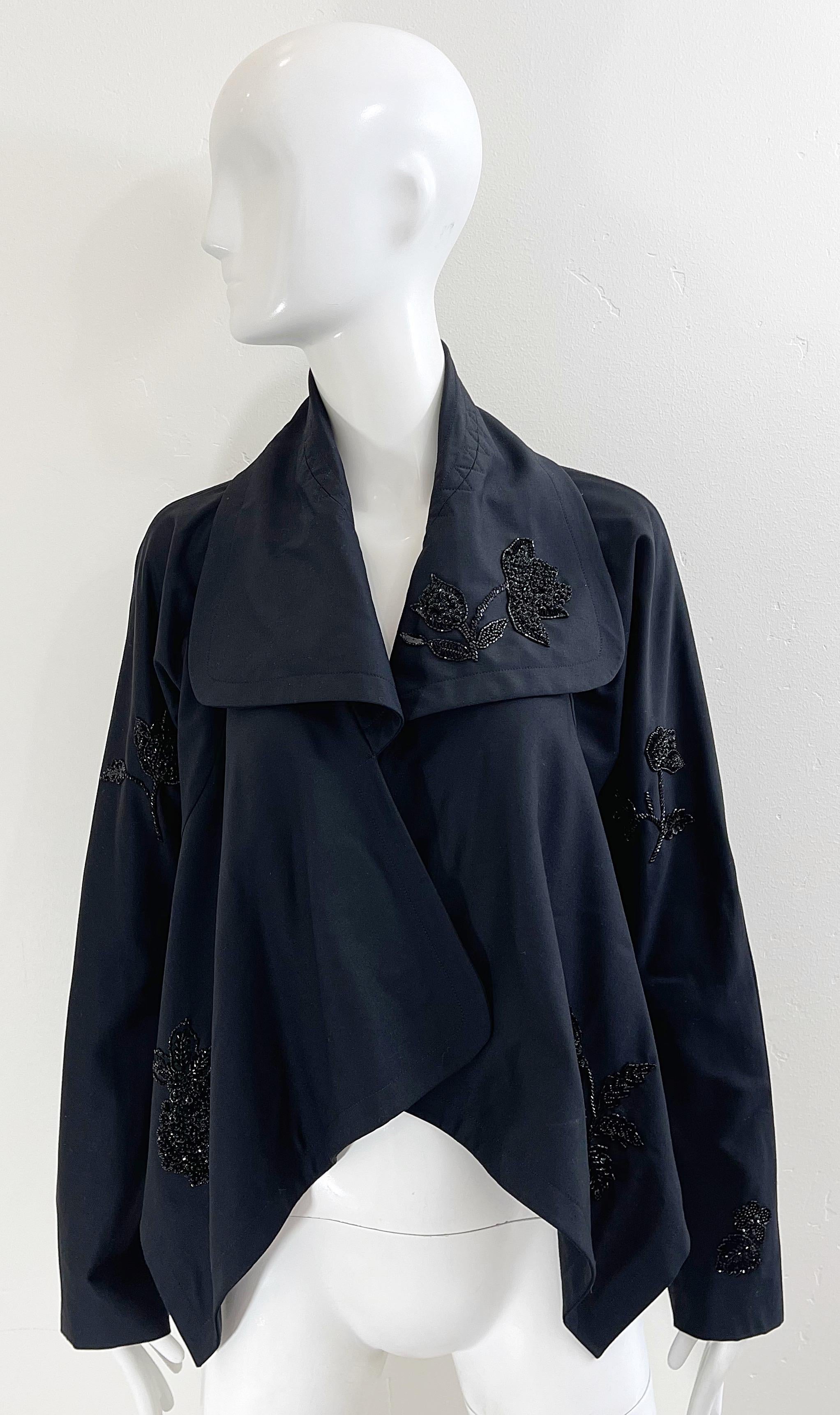 Beautiful early 2000s new with tags deadstock JOHN GALLIANO black beaded open front swing jacket ! Features hundreds of hand-sewn black beads throughout the entire jacket. The perfect layering piece for anytime of year. 
In great unworn condition,