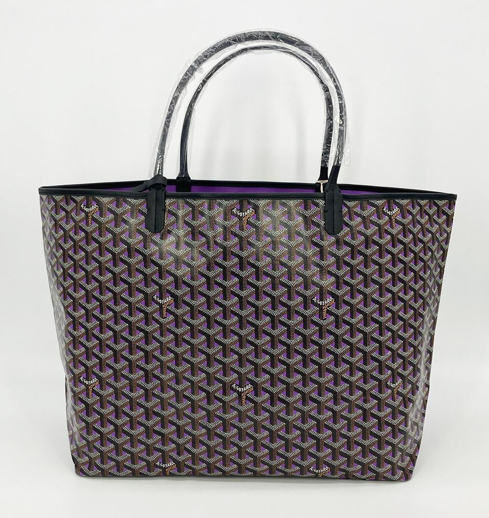 NWT Limited Edition Goyard Saint Louis Claire Voie GM in new unused condition. Limited edition purple and black opaline claire voie coated monogram canvas exterior trimmed with black leather edges and handles. Purple canvas lined interior that can