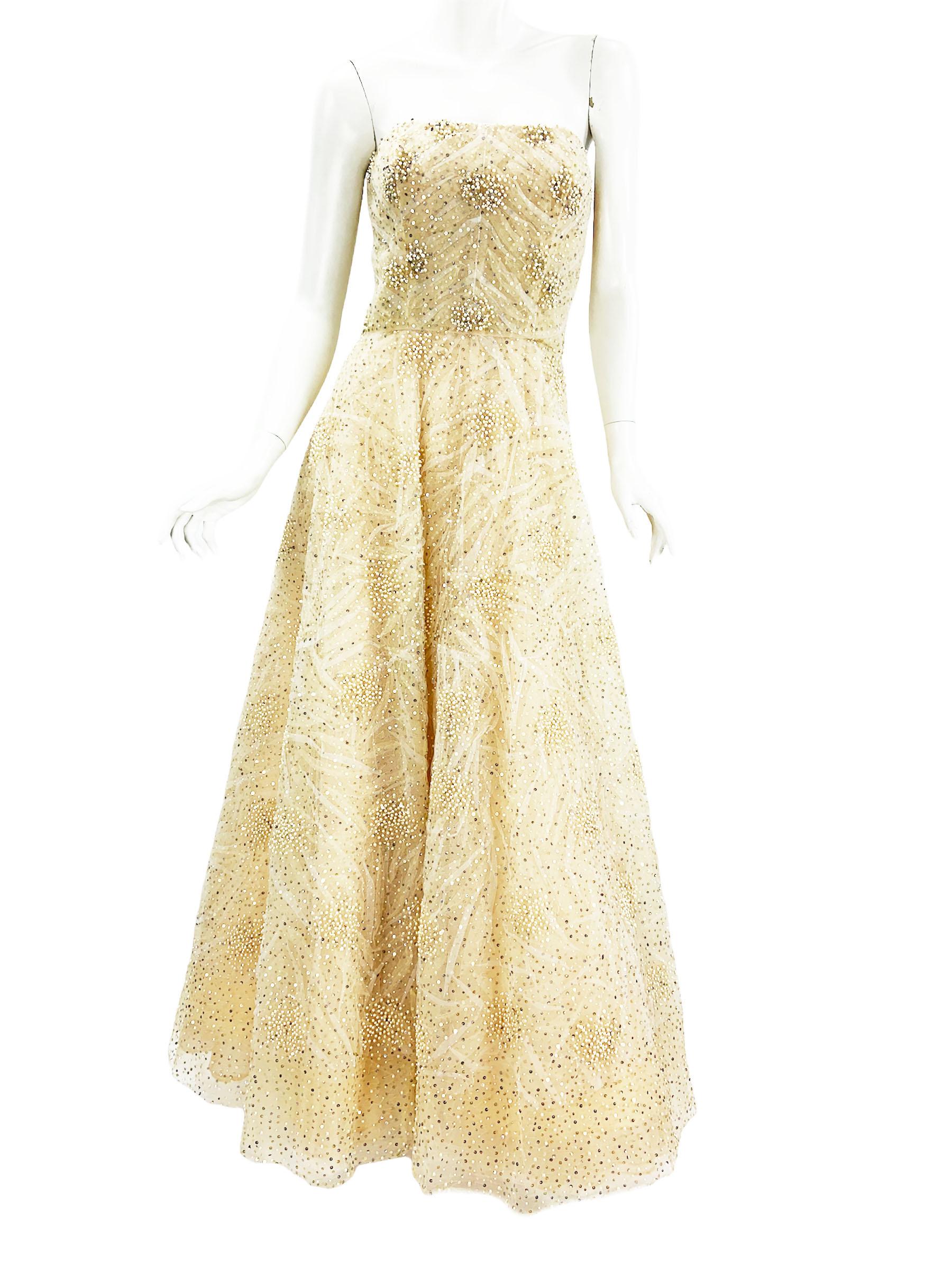 New Oscar De La Renta Champagne Tulle Dress Gown
US size - 8
2008 Collection
Double tulle - white on the top of champagne - finished with white pearl-looking round beads and two tone sequins. 
Gown topped by a figure flattering corset. Multiple
