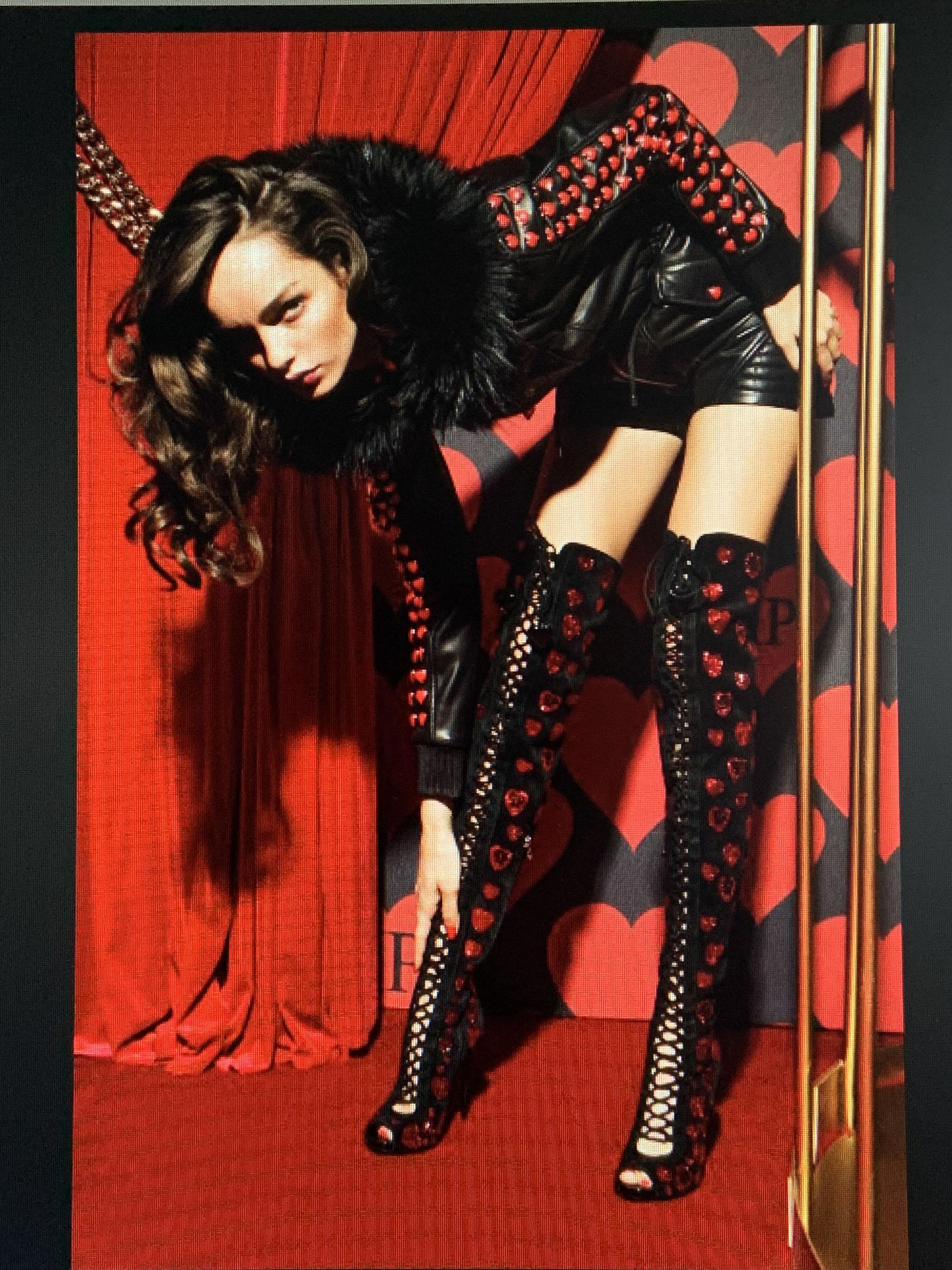 Make a bold statement with these striking Philipp Plein  *Ganesha* over-the-knee boots, crafted in luxurious black suede leather. The design features an intricate lace-up front and is lavishly embellished with sparkling red crystal hearts, many