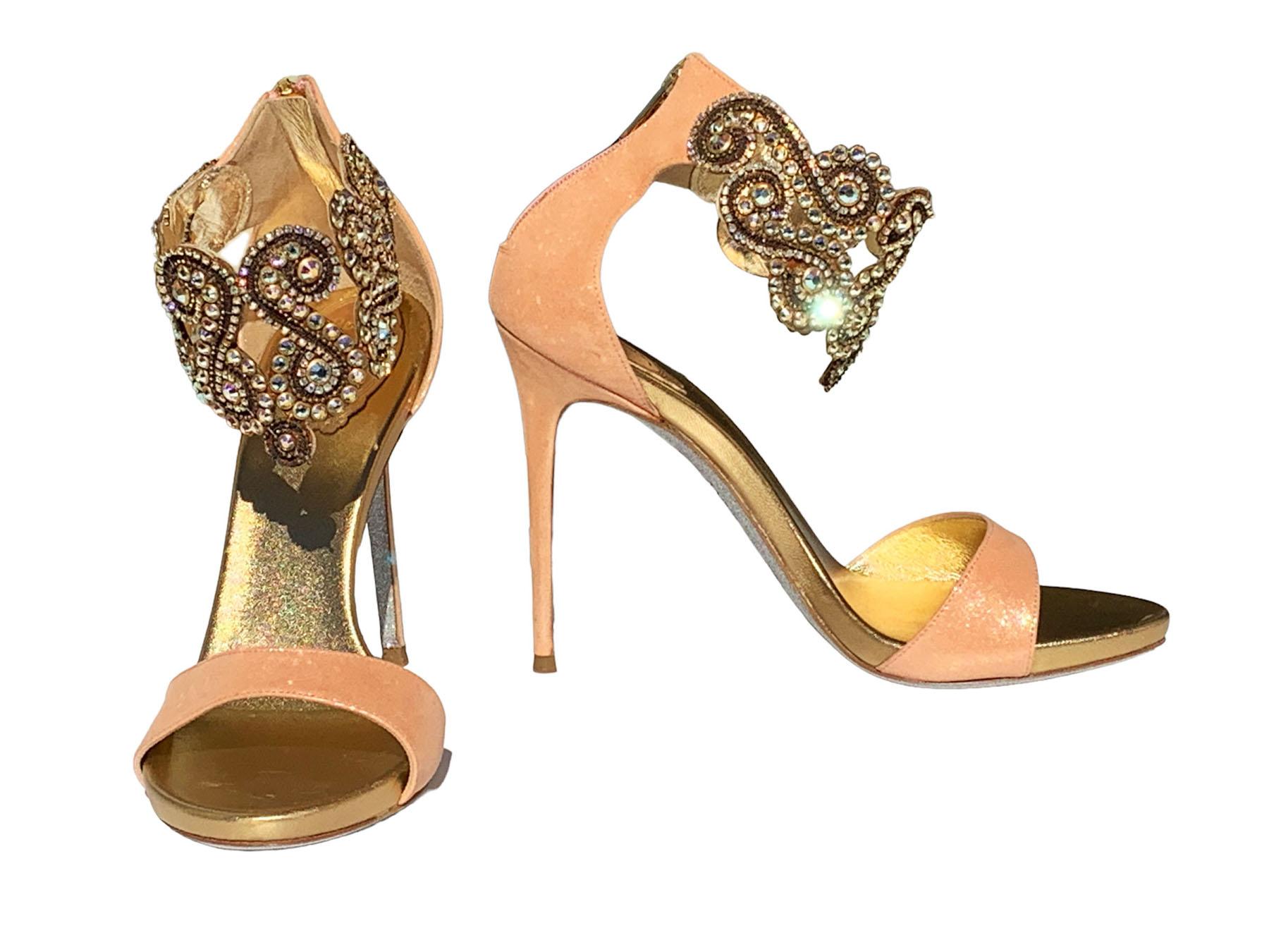 Rene Caovilla Embellished Metallic Leather Sandals 
Italian size - 37.5  Fits true to size. 
Peach and gold colors, Metallic leather, Crystal and chain-embellished ankle strap, Round toe, Glitter-finished sole, Zip fastening along back. 
Heel