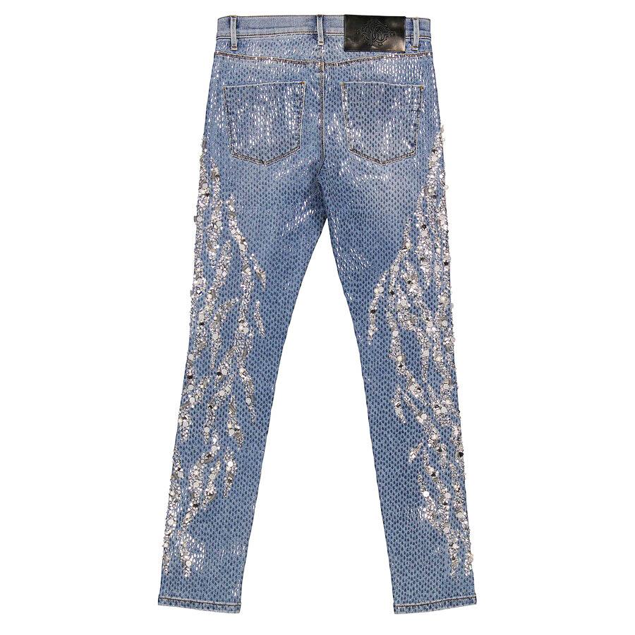 New with tags, these Roberto Cavalli jeans from the 2018 runway collection are a striking example of the brand’s bold glamour. Crafted in classic blue denim, the jeans are fully adorned with hand-applied crystals, beads, sequins, and pearl-like