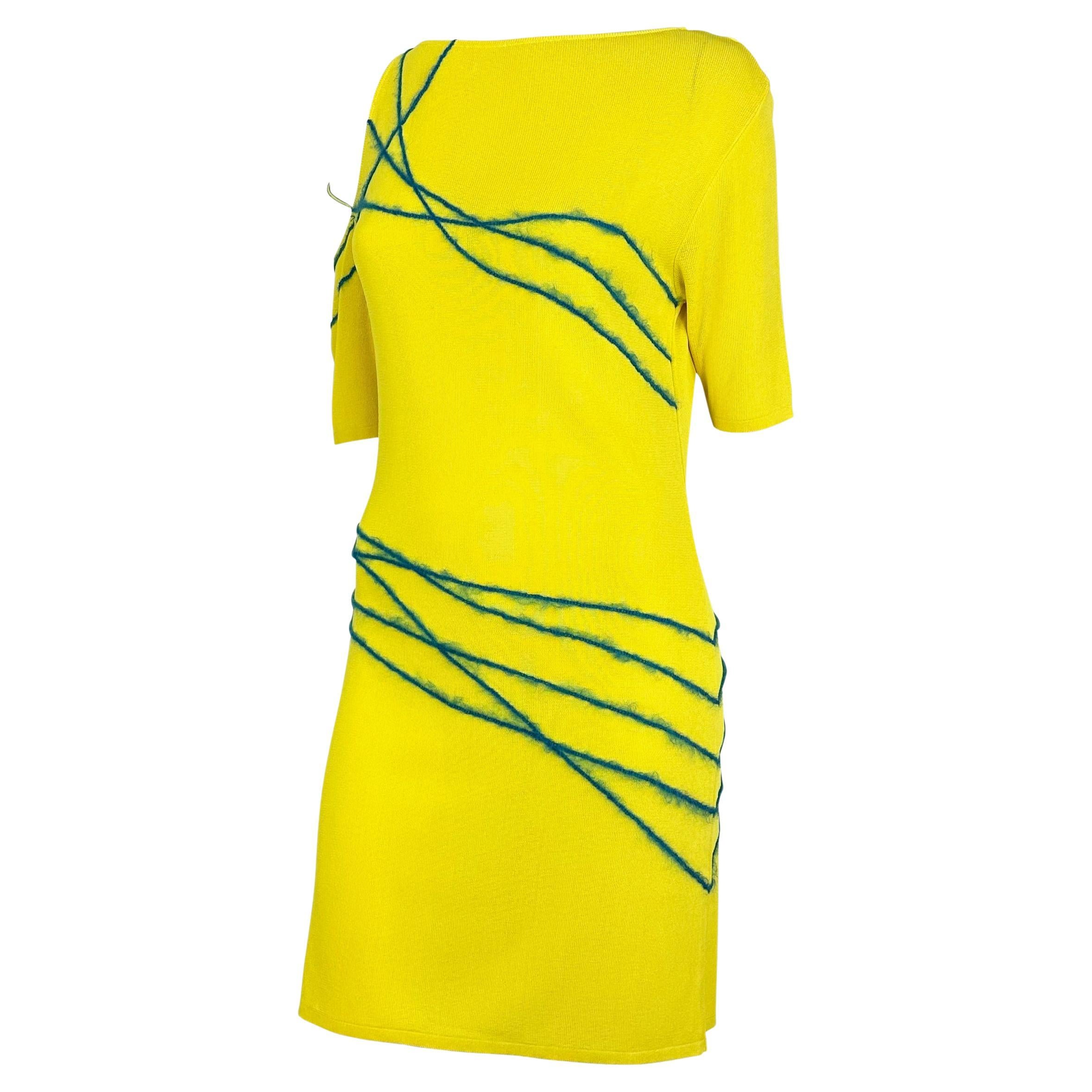 Presenting a fabulous yellow knit Gianni Versace dress, designed by Donatella Versace. From the Spring/Summer 1998 collection, similar knit dresses debuted on the season's runway. This vibrant yellow dress features an exposed shoulder, half-length