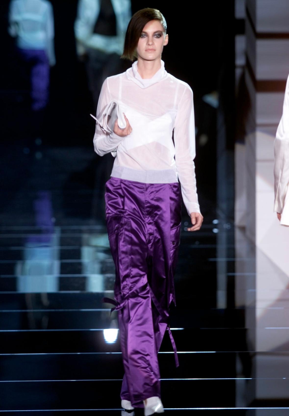 Presenting a pair of incredible purple satin Gucci pants, designed by Tom Ford. From the Spring/Summer 2001 collection, these extra-wide leg pants debuted on the season's runway, modeled by Mia Hessner. Entirely constructed of vibrant purple satin,