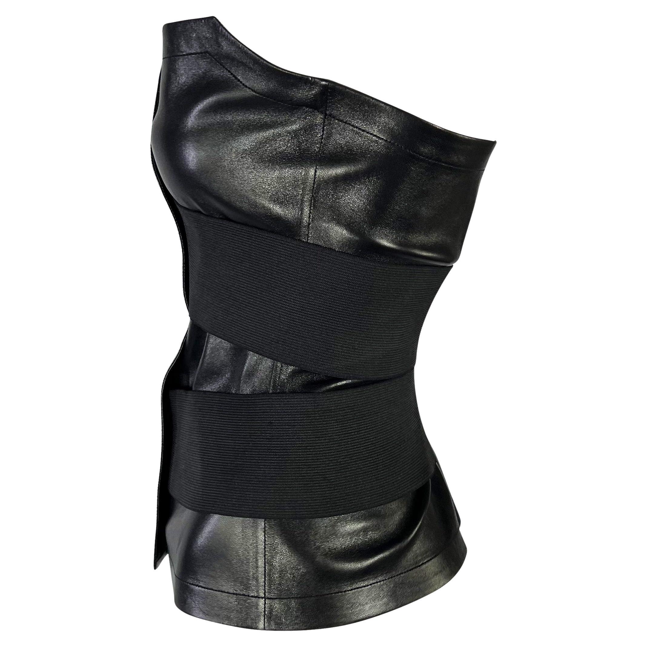 Presenting a stunning leather bandage strap Yves Saint Laurent Rive Gauche bustier top, designed by Tom Ford. From the Spring/Summer 2001 collection,  many similar strap designs debuted on the season's runway. This ultra sleek and sexy corset is