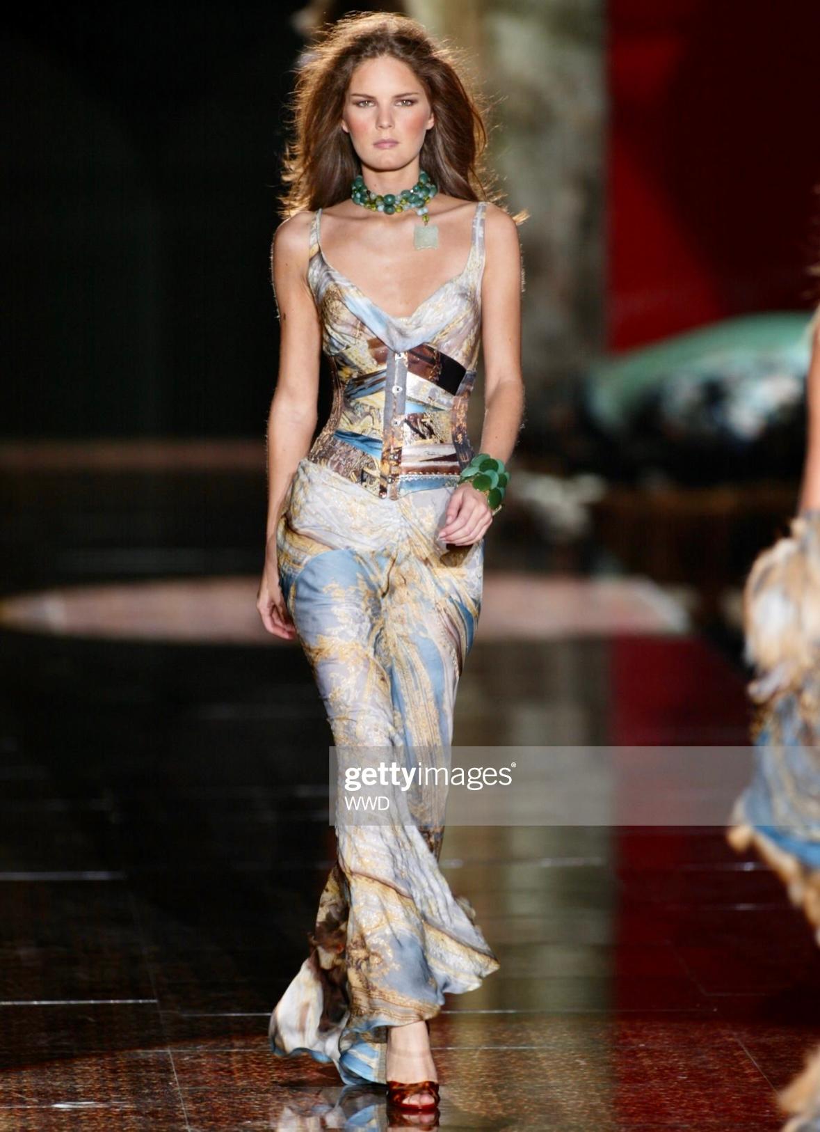 Presenting a fabulous baroque print Roberto Cavalli high-waisted maxi skirt. From the Spring/Summer 2003 collection, this skirt depicts a baroque-style room with musical instruments. Similar prints were featured in the season's runway presentation.