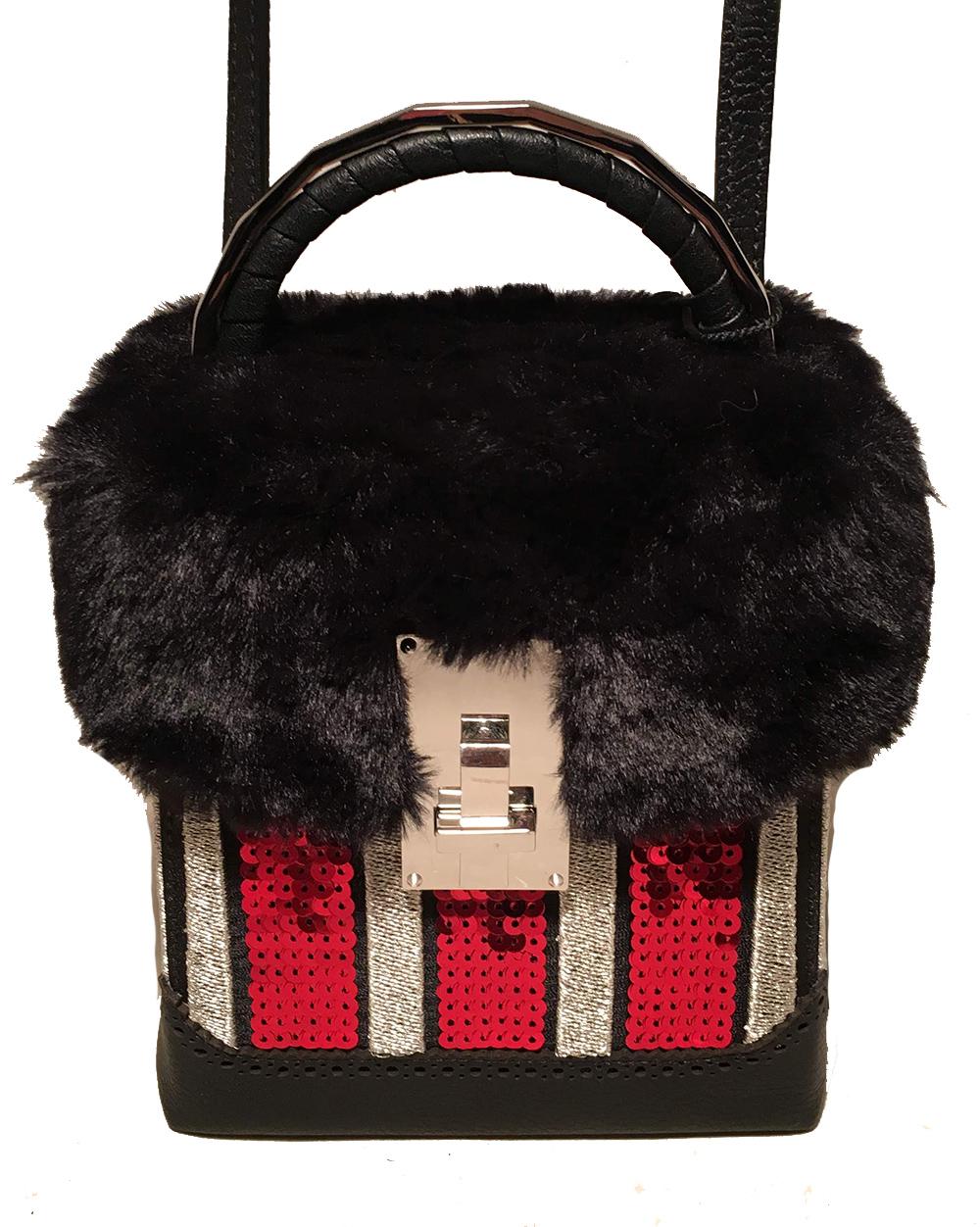 NWT The Volon Red Sequin & Black Fur Great Box Bag in NWT condition. Red sequin paillette and silver embroidered stripes along body with a soft black fur top. Silver hardware with black leather trim and attached shoulder strap. Front latch closure