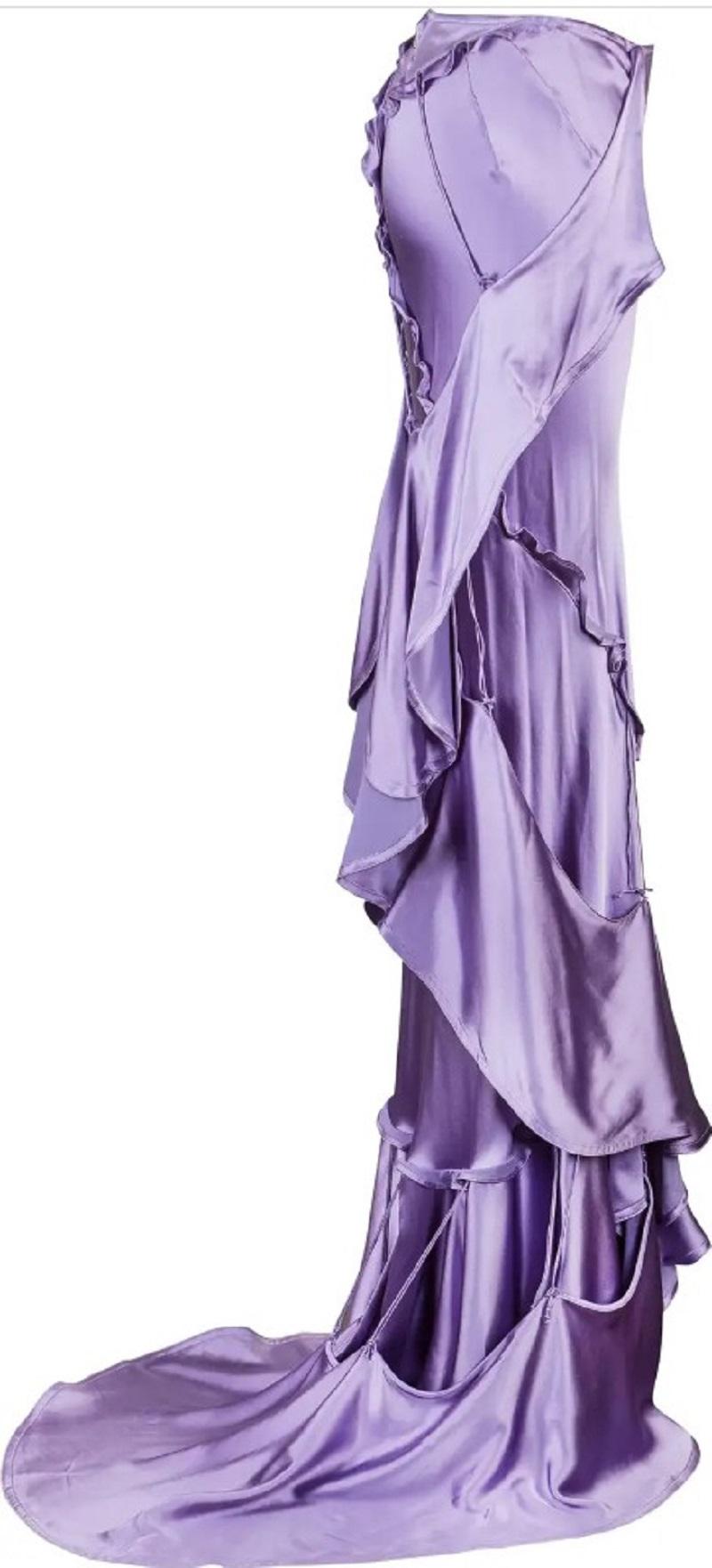 New Tom Ford for Yves Saint Laurent Rive Gauche Silk Maxi Skirt
F/W 2003 Runway Collection
French size 36 - US 4
Artfully constructed from ruffles which are connected by ties to the skirt.
Lavender color., 100% silk. High - Low style. Zipper