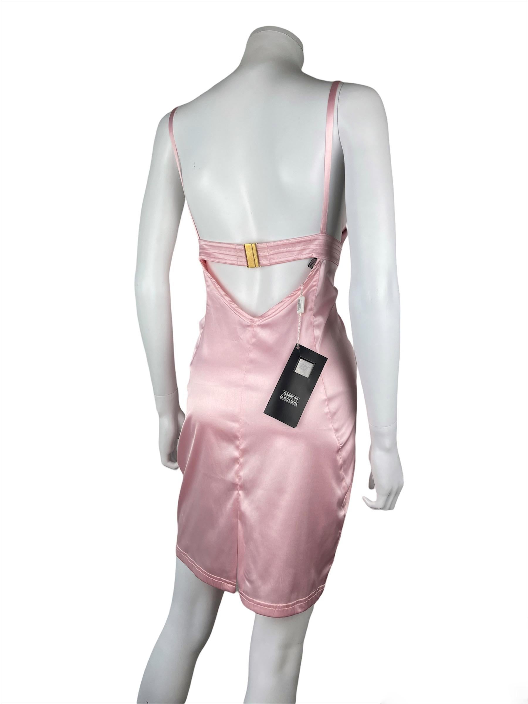 VERSUS by Gianni Versace, Made in Italy, circa 90’s.
Pink bodycon mini dress designed by Gianni Versace for Versus. 
This dress has a very Y2K vibe with her shiny pink color.
The dress is stretchy and has a bit of a latex effect. 
It is too big for
